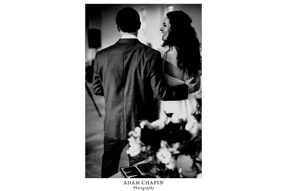 bride and groom talking and embracing during the toasts at their wedding reception