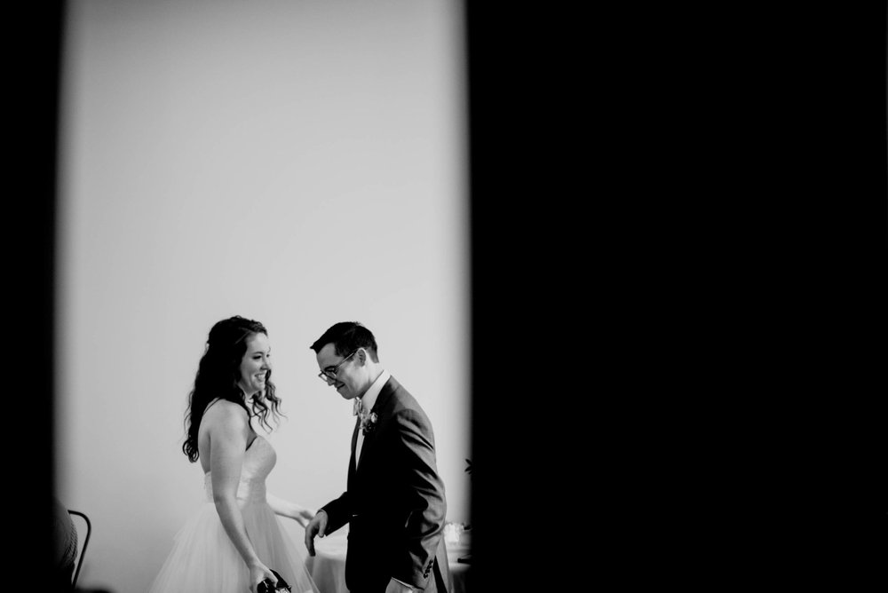 bride and groom laughing together during their wedding reception