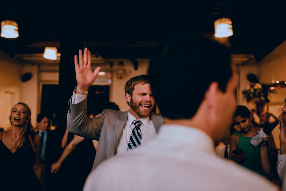 wedding guests getting funky during wedding reception