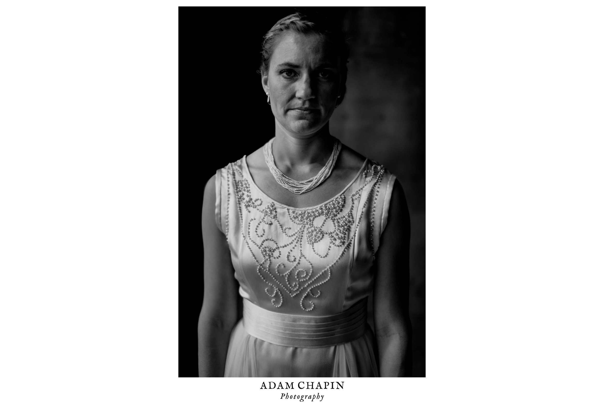black and white portrait of bride wearing her great grandmothers 1929 wedding dress at the haw river ballroom
