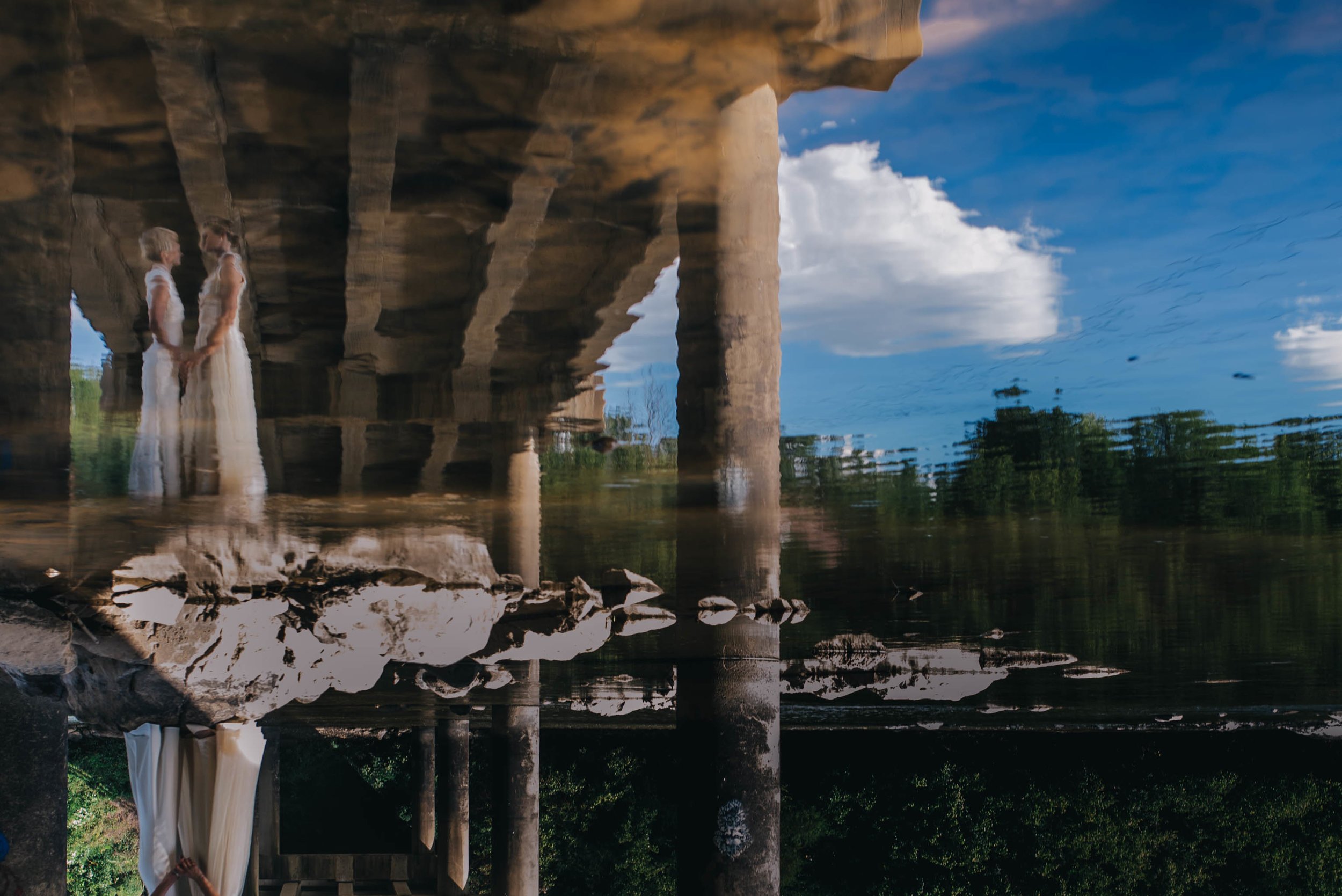 reflection of the brides in the Haw river in saxapawhaw