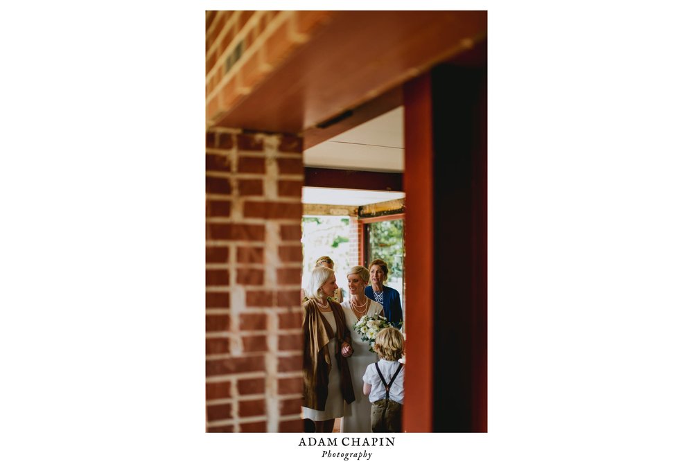 bride and her mother getting in line just before the wedding ceremony