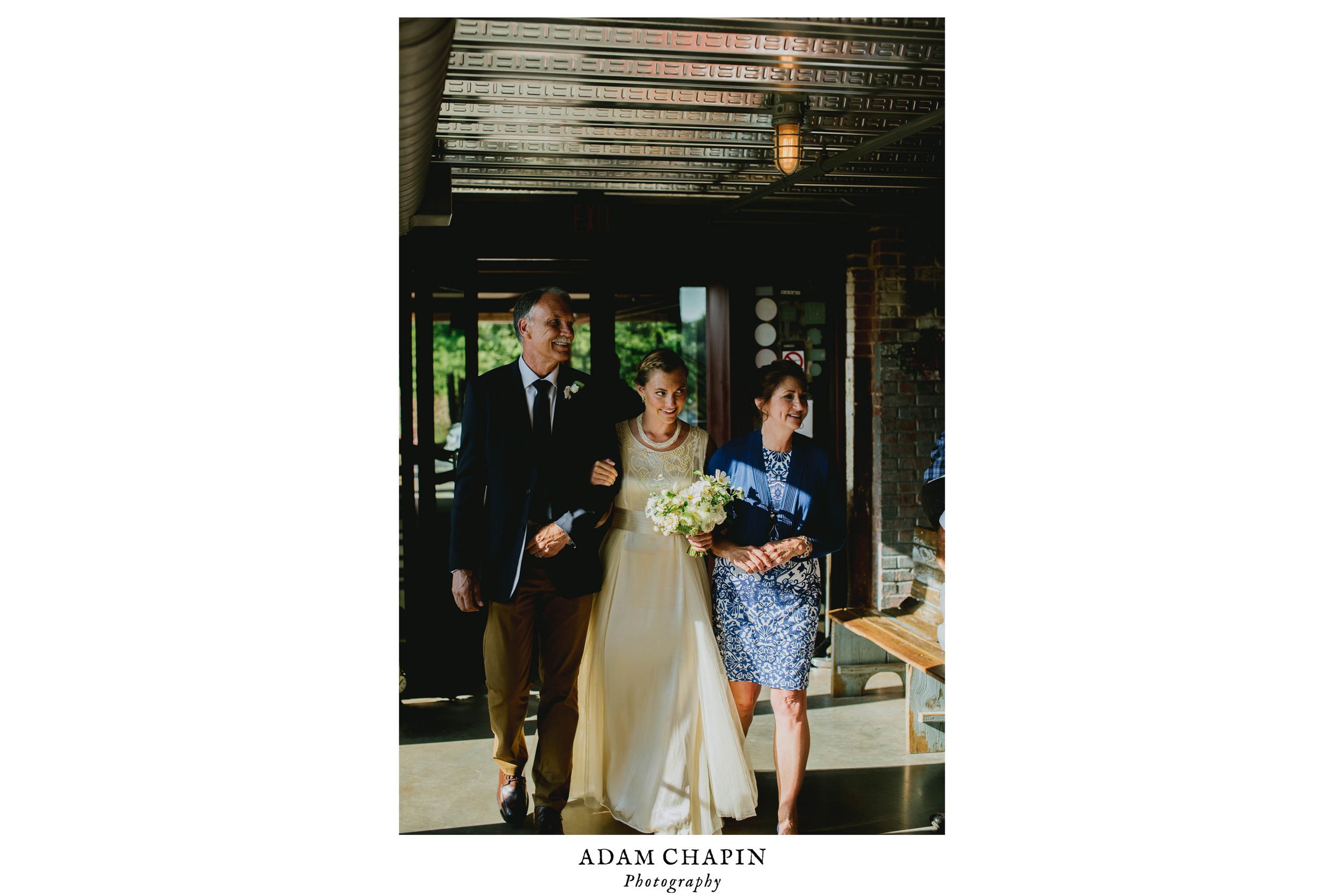 bride and her parents during the processional before her haw river ballroom wedding ceremony