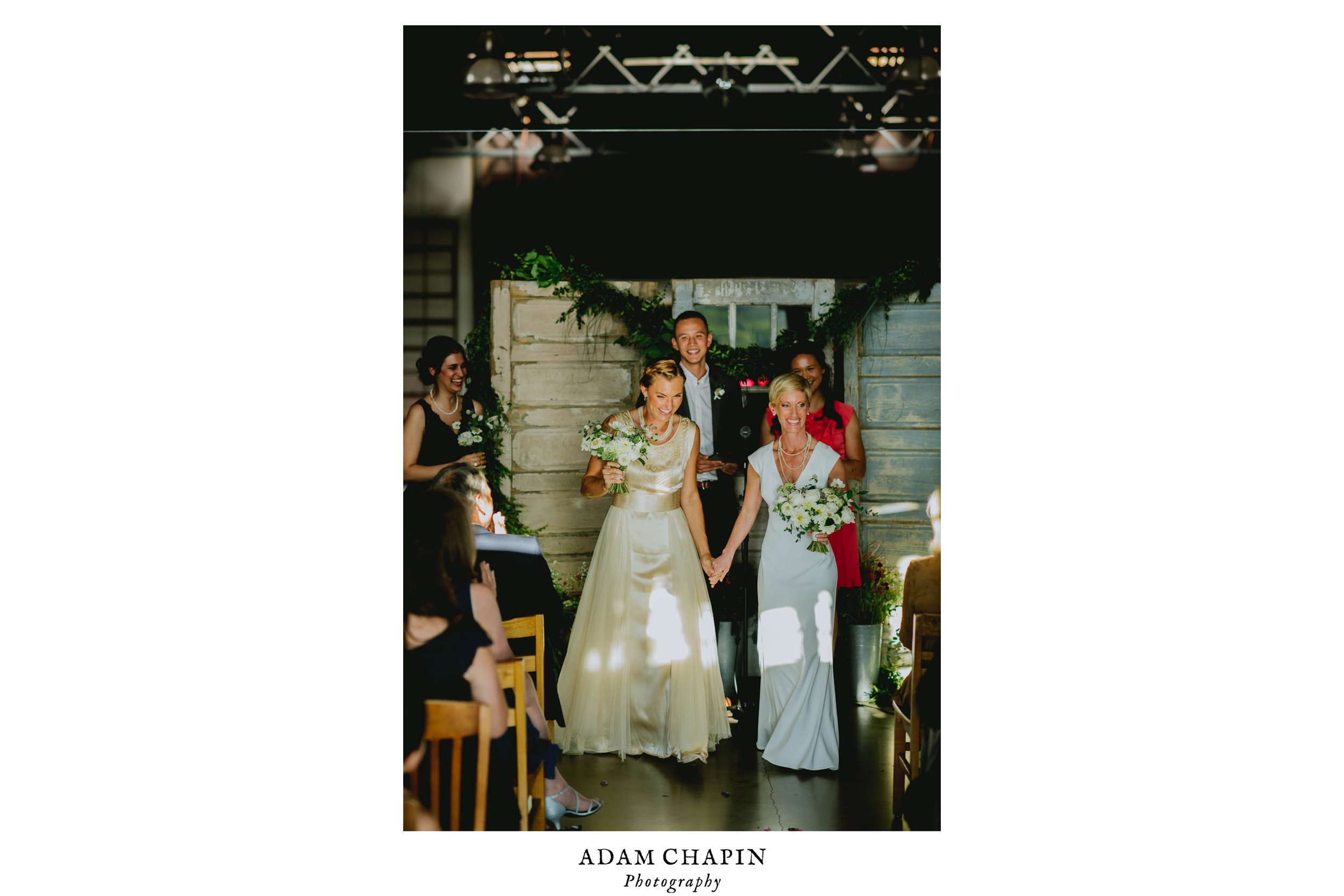 brides celebrating their marriage being official after their haw river ballroom wedding ceremony