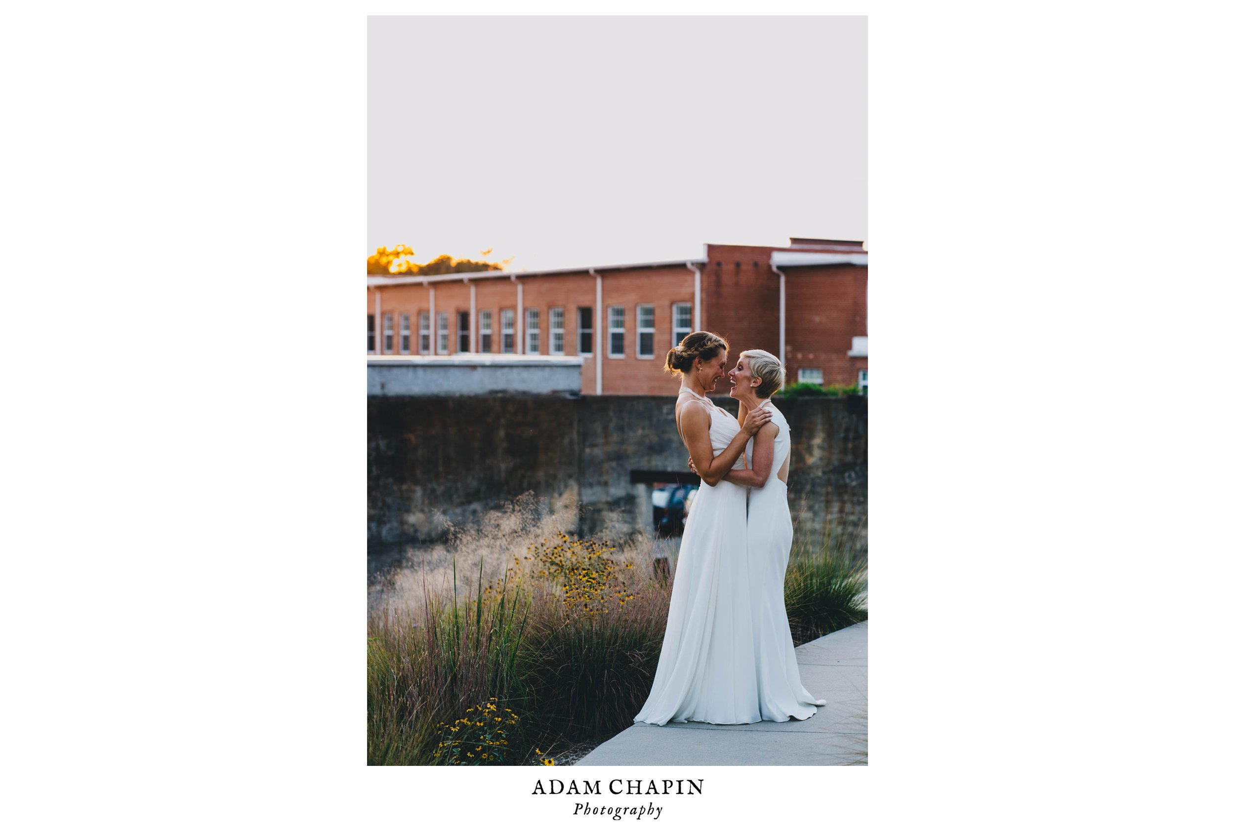 brides loving on each other just after their haw river ballroom wedding 