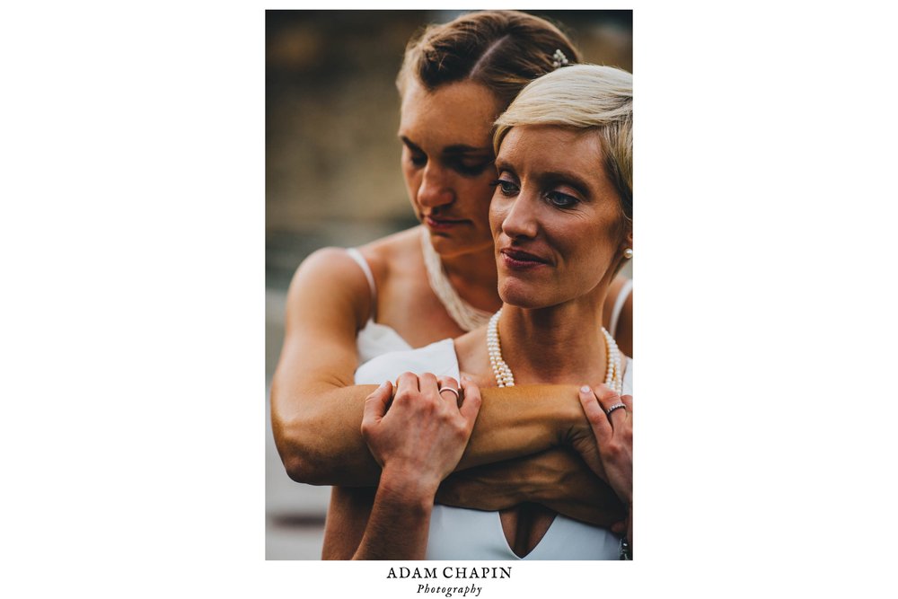 bride hugging her bride just outside of the haw river ballroom