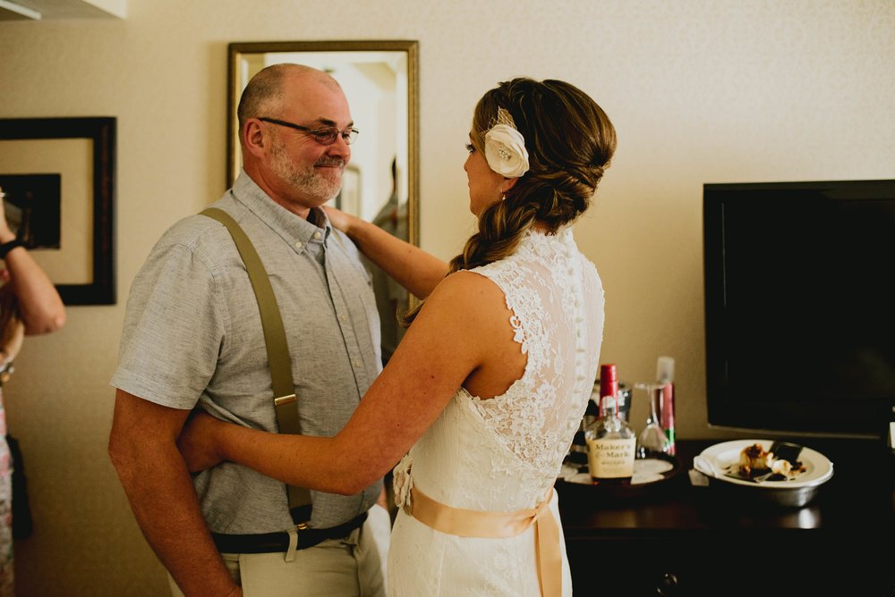 father of the bride and his daughter seeing each other for the first time