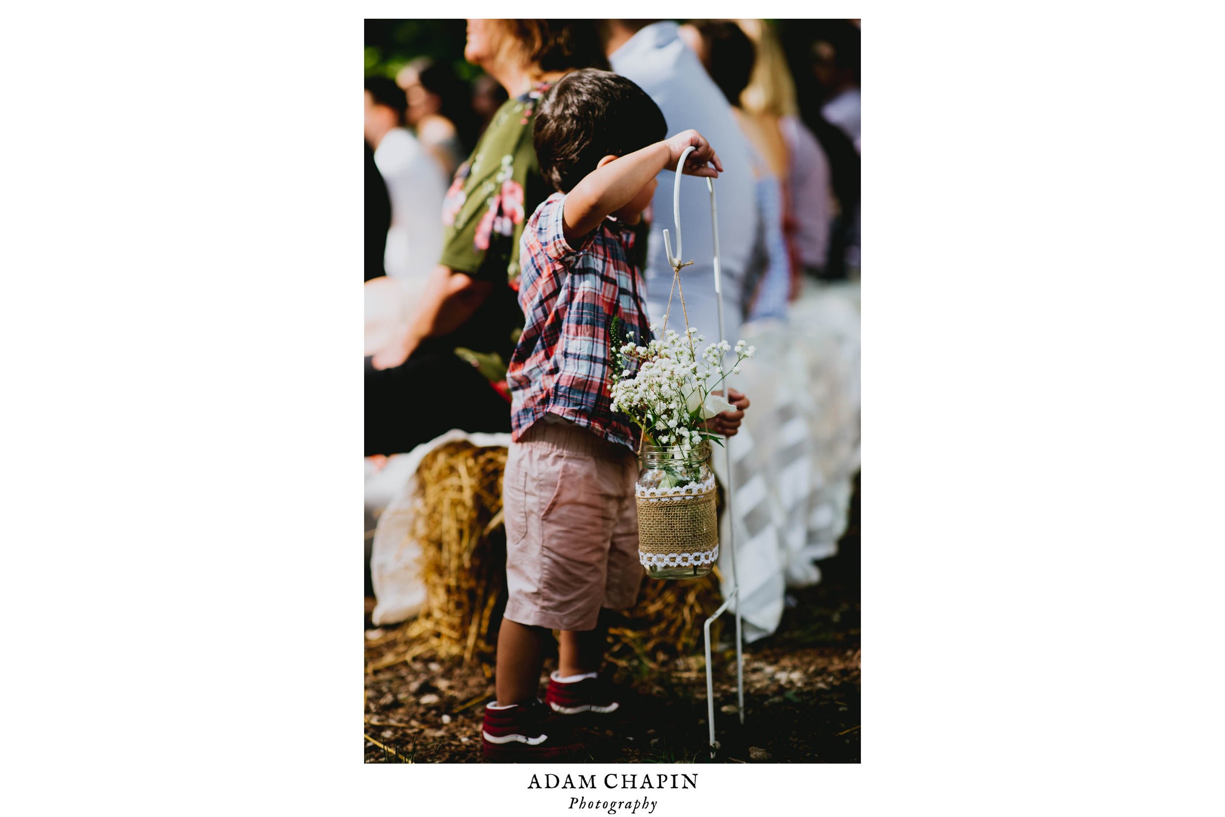wedding guest child playing with flowers