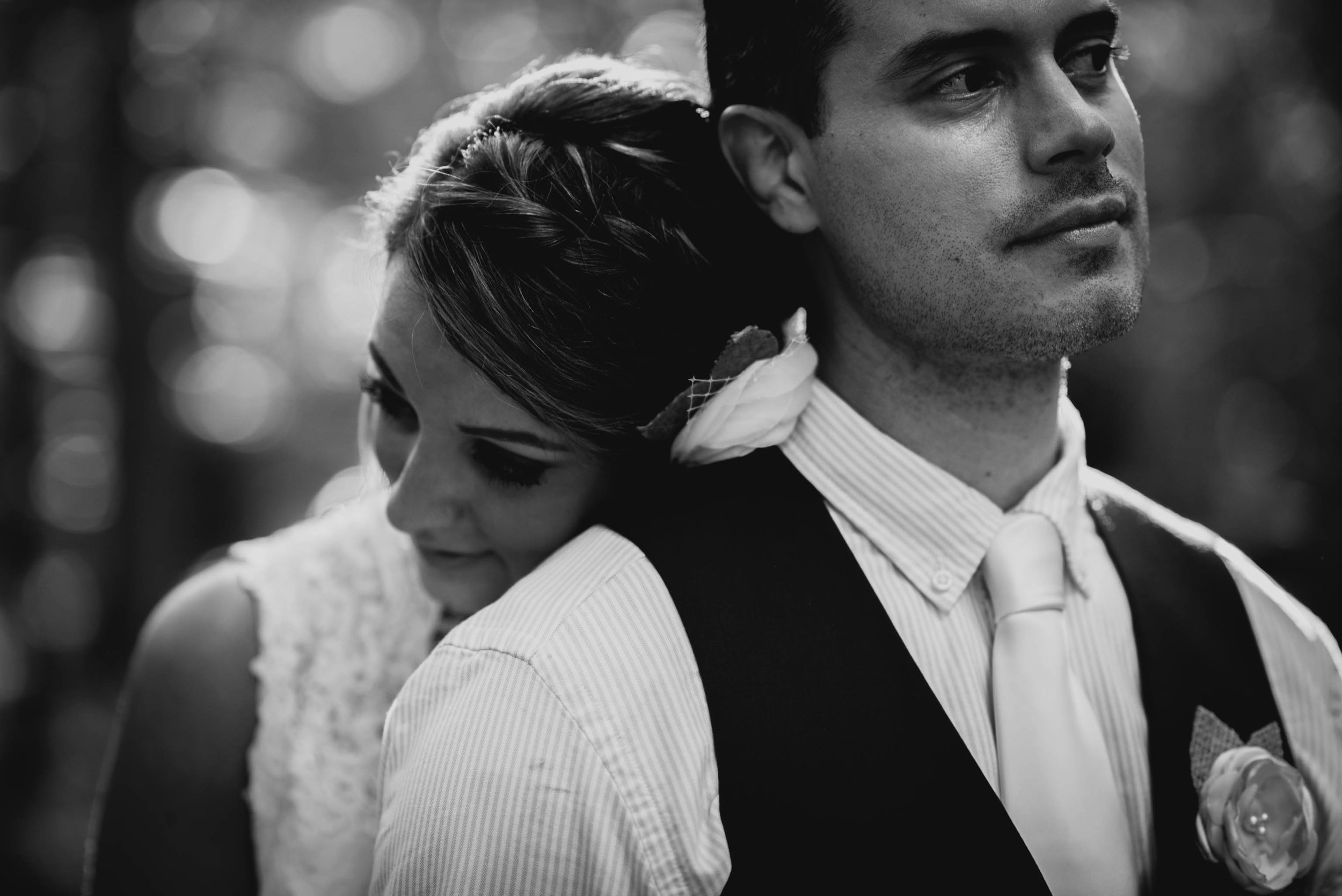 bride resting her head on the back of the grooms shoulder