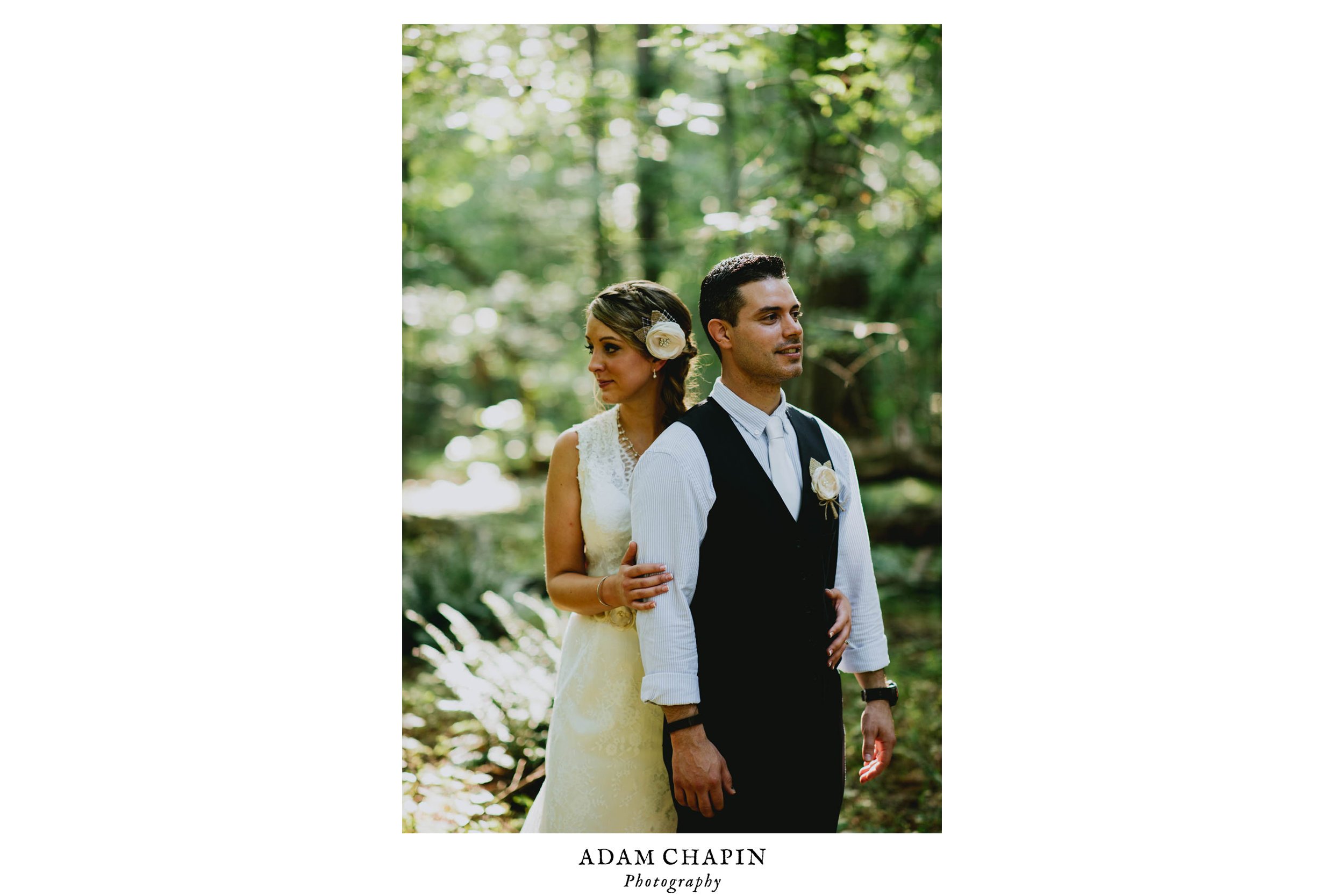 bride and groom standing in the forest after their duke forest wedding