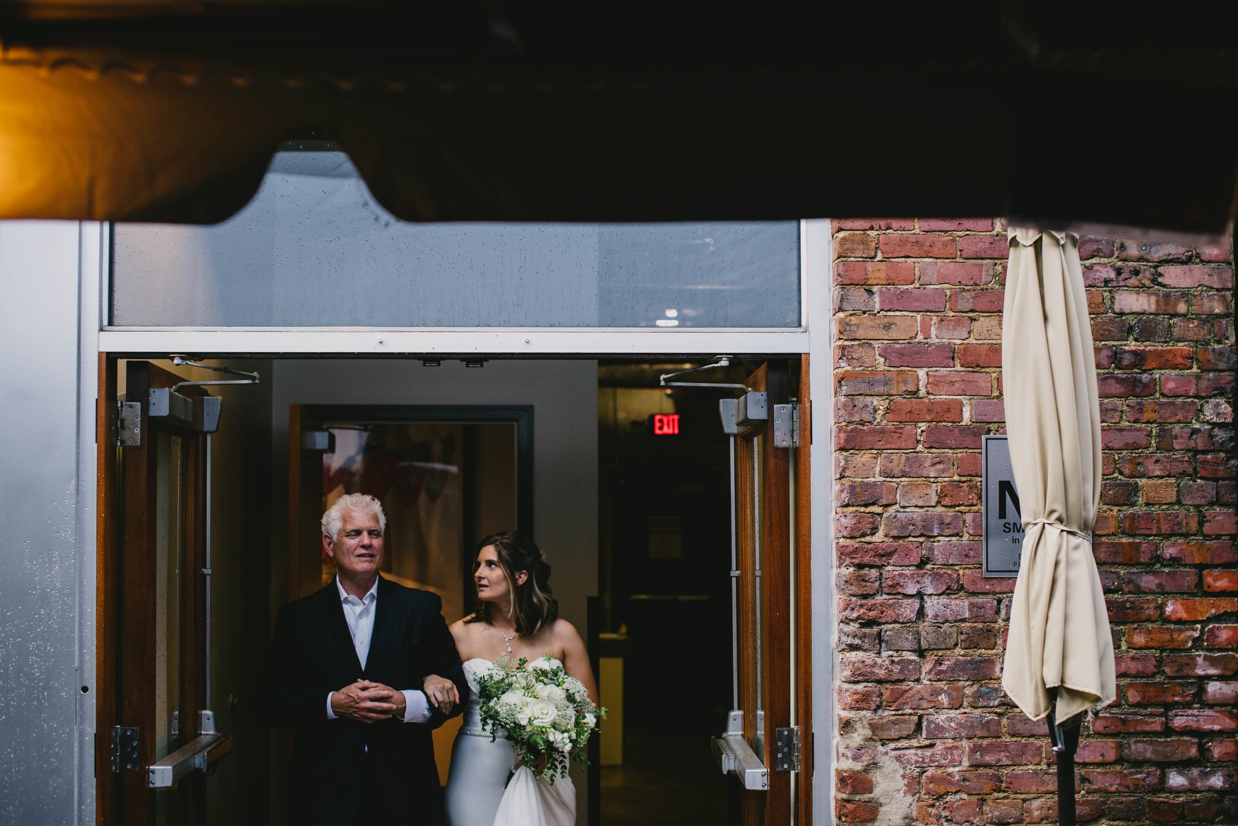bride getting ready to walk down aisle with her father at her Jiddi Space and Courtyard Wedding at Sitti Restaurant