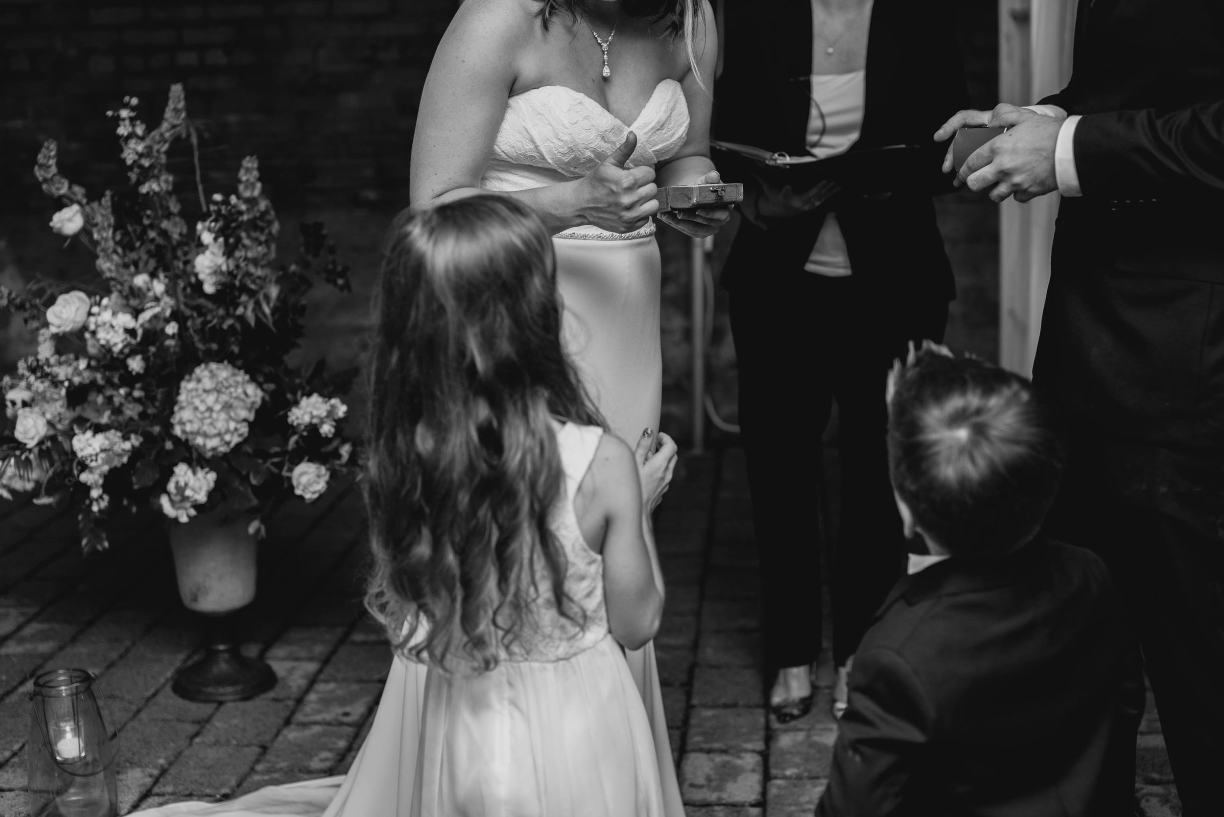 ring bearers handing off the rings during ceremony of this Jiddi Space and Courtyard Wedding at Sitti Restaurant