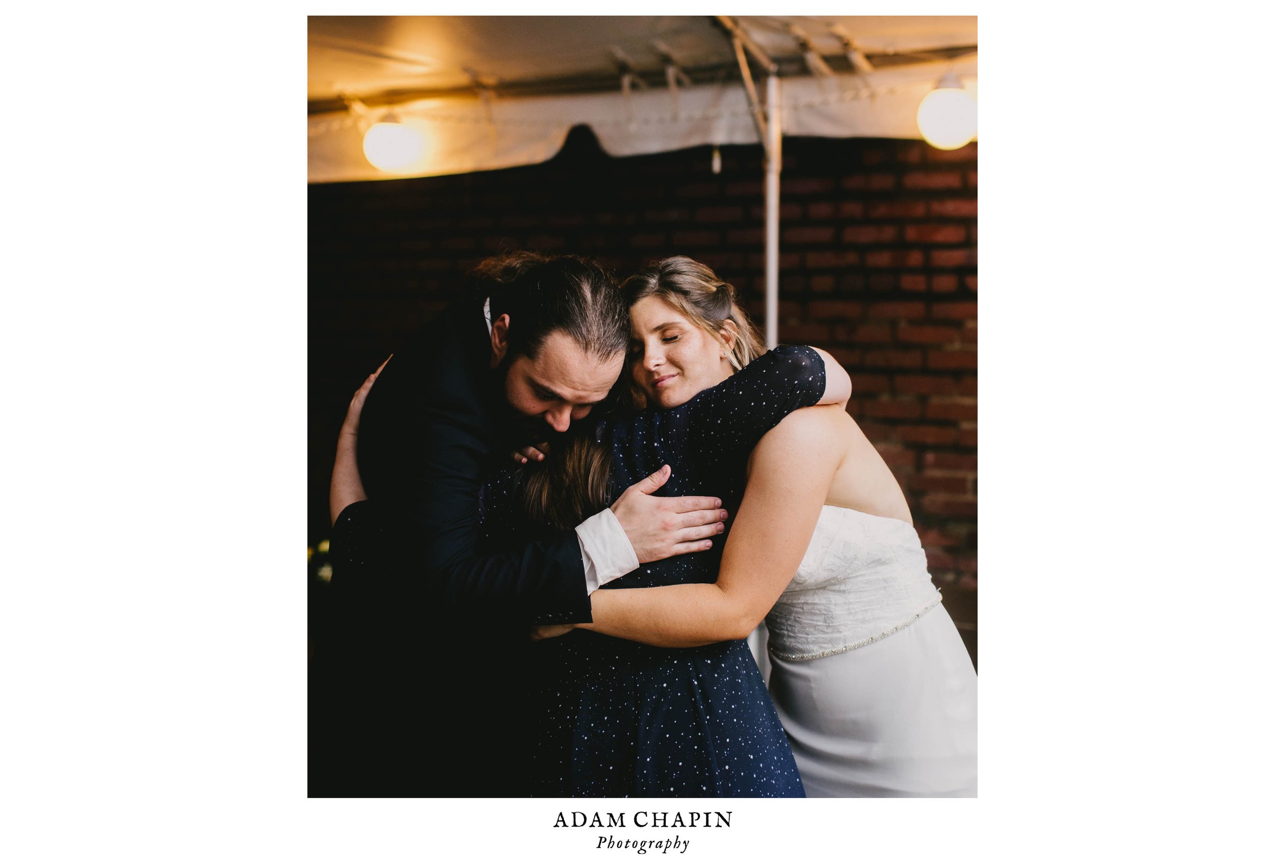 bride and groom hugging sister in law during their Jiddi Space and Courtyard Wedding at Sitti Restaurant