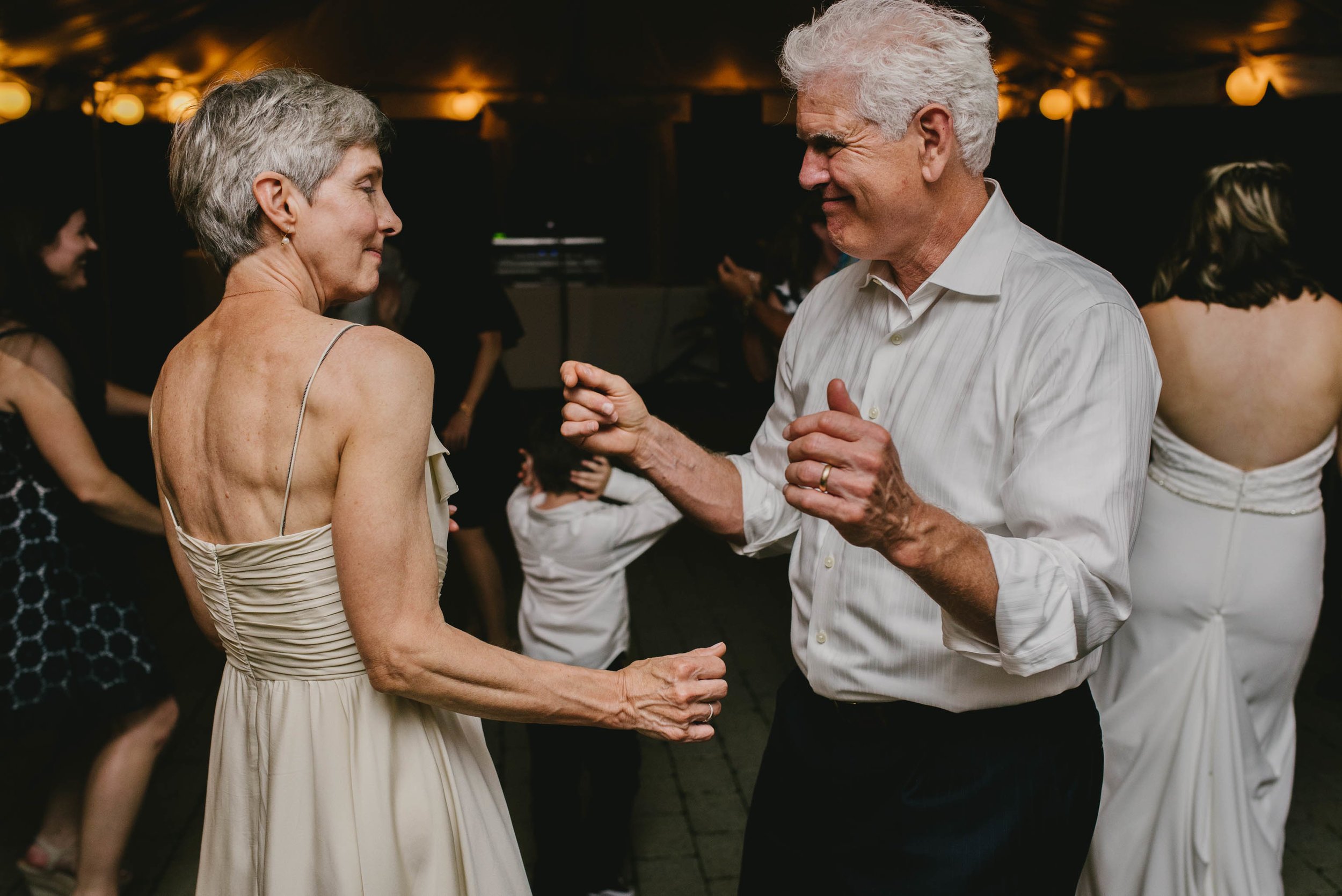 mother and father of the bride dancing during reception at their daughter's Jiddi Space and Courtyard Wedding at Sitti Restaurant