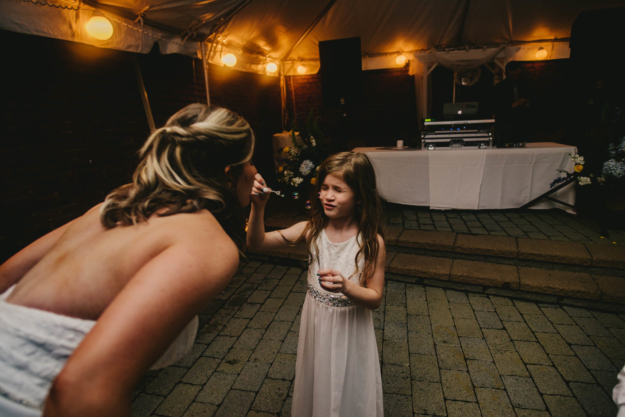 bride dancing with flower girl 