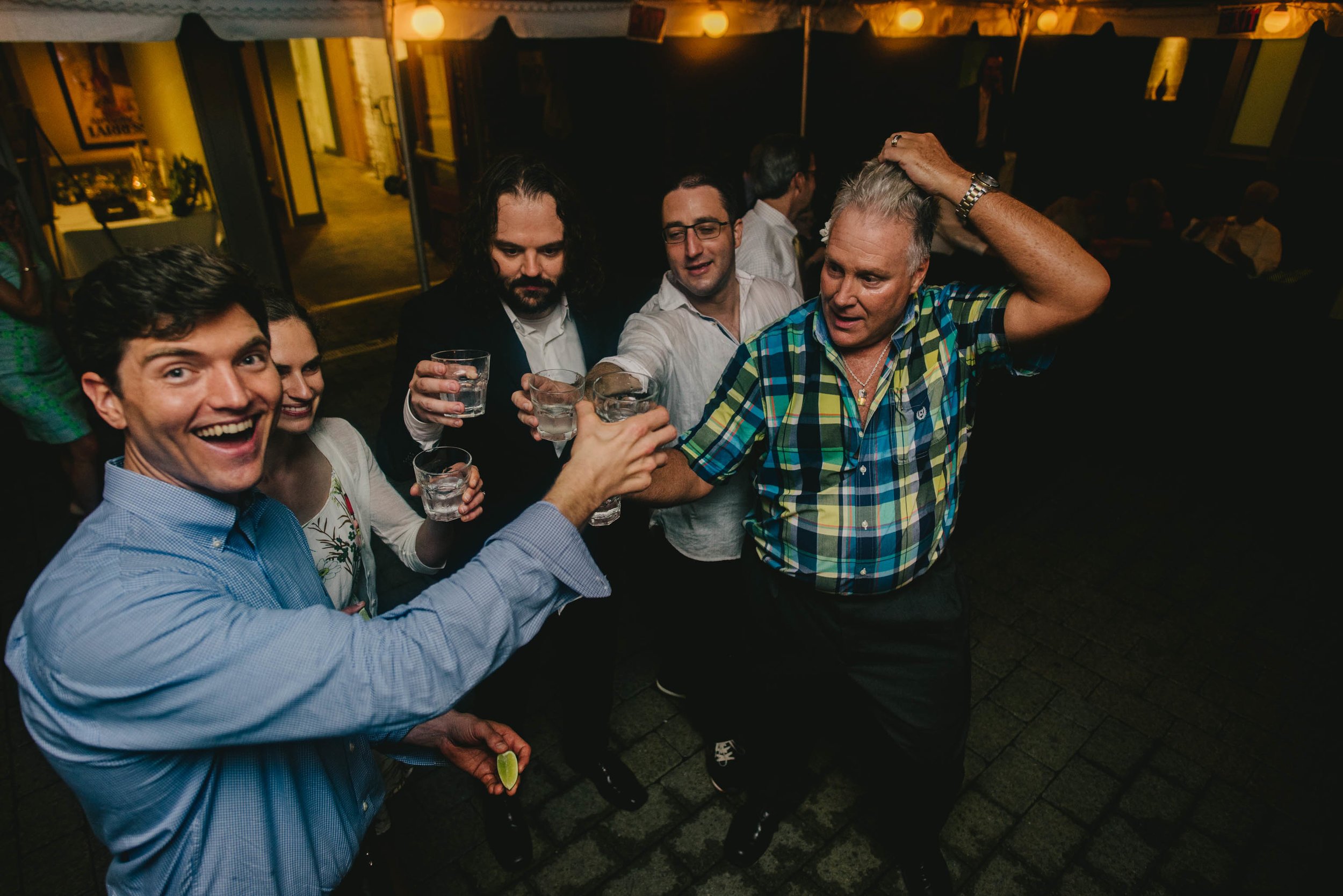 groom and guests taking tequila shot during their Jiddi Space and Courtyard Wedding at Sitti Restaurant