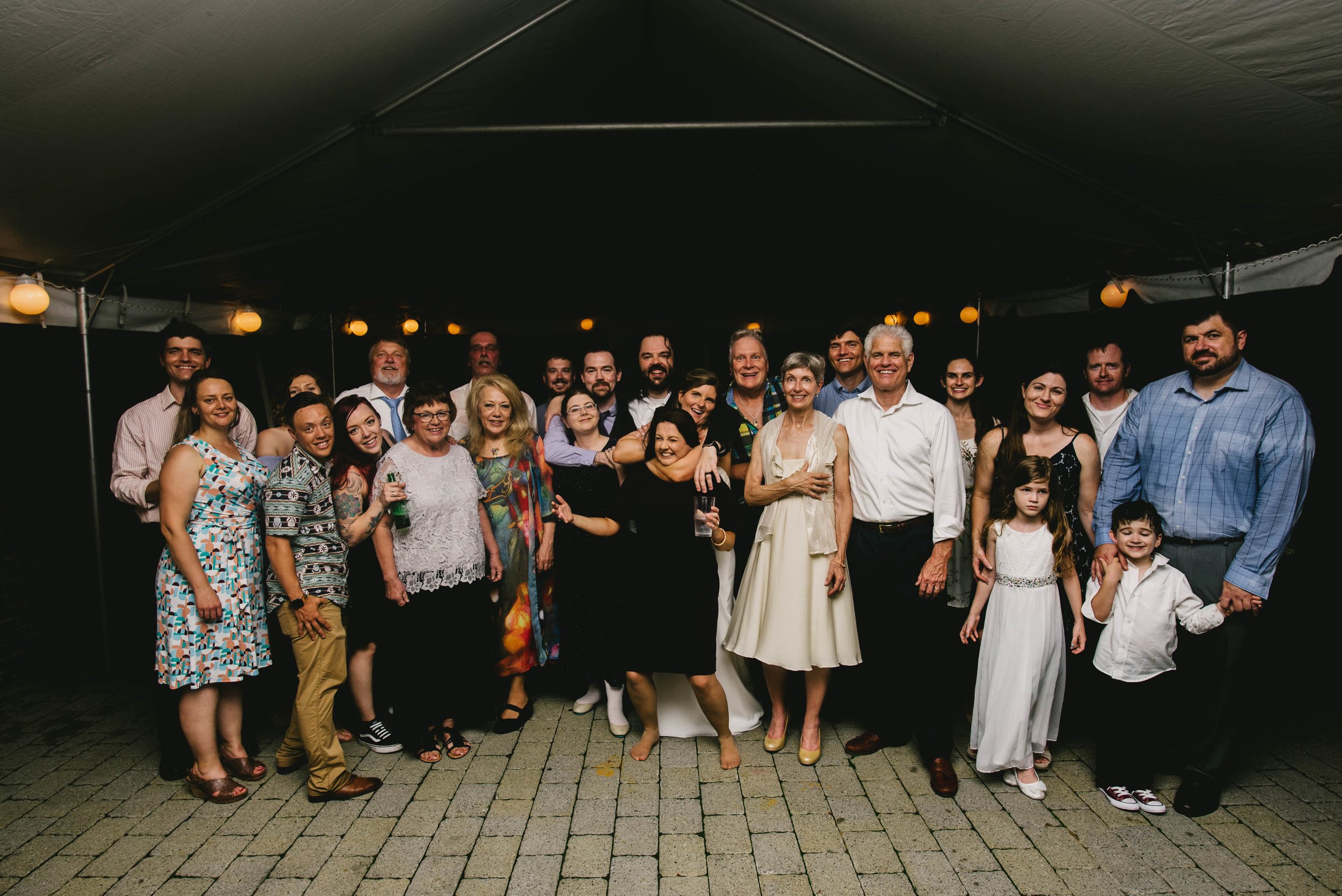 all the wedding guests pose for a group photo at this Jiddi Space and Courtyard Wedding at Sitti Restaurant