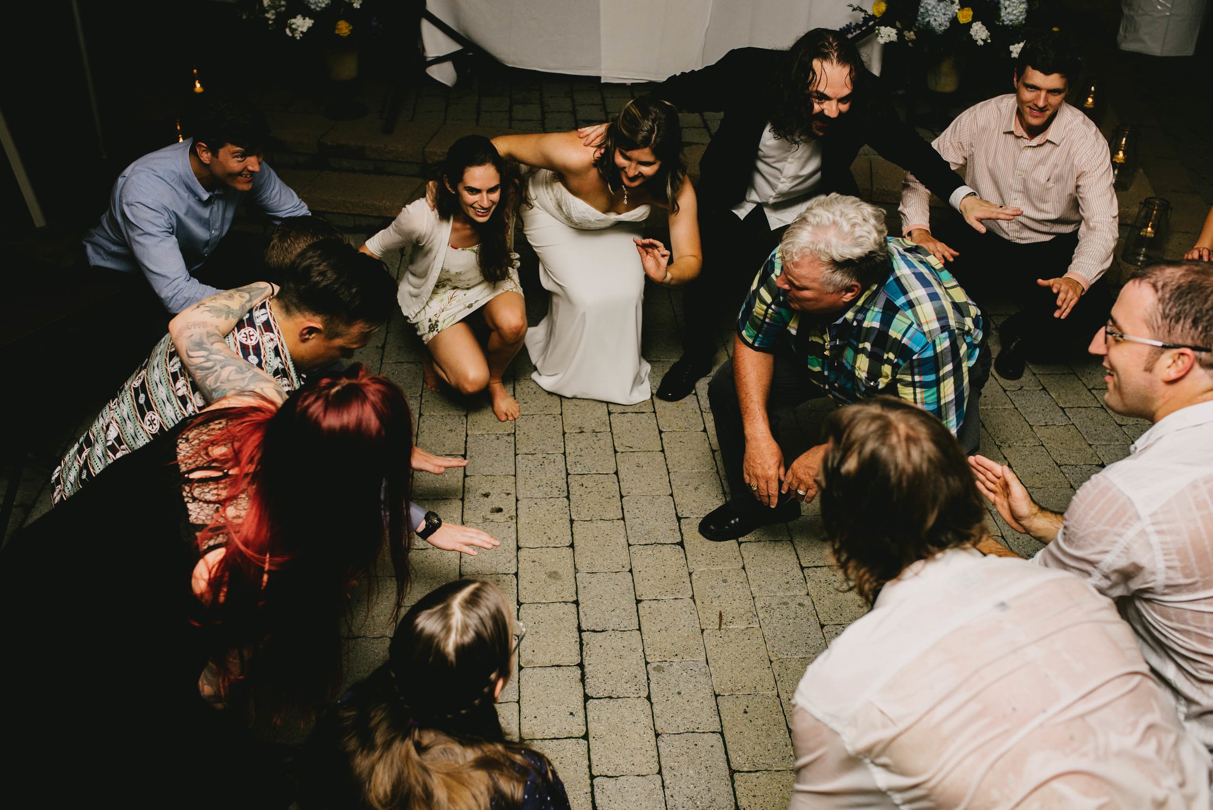 wedding guests getting low to shout at this Jiddi Space and Courtyard Wedding at Sitti Restaurant