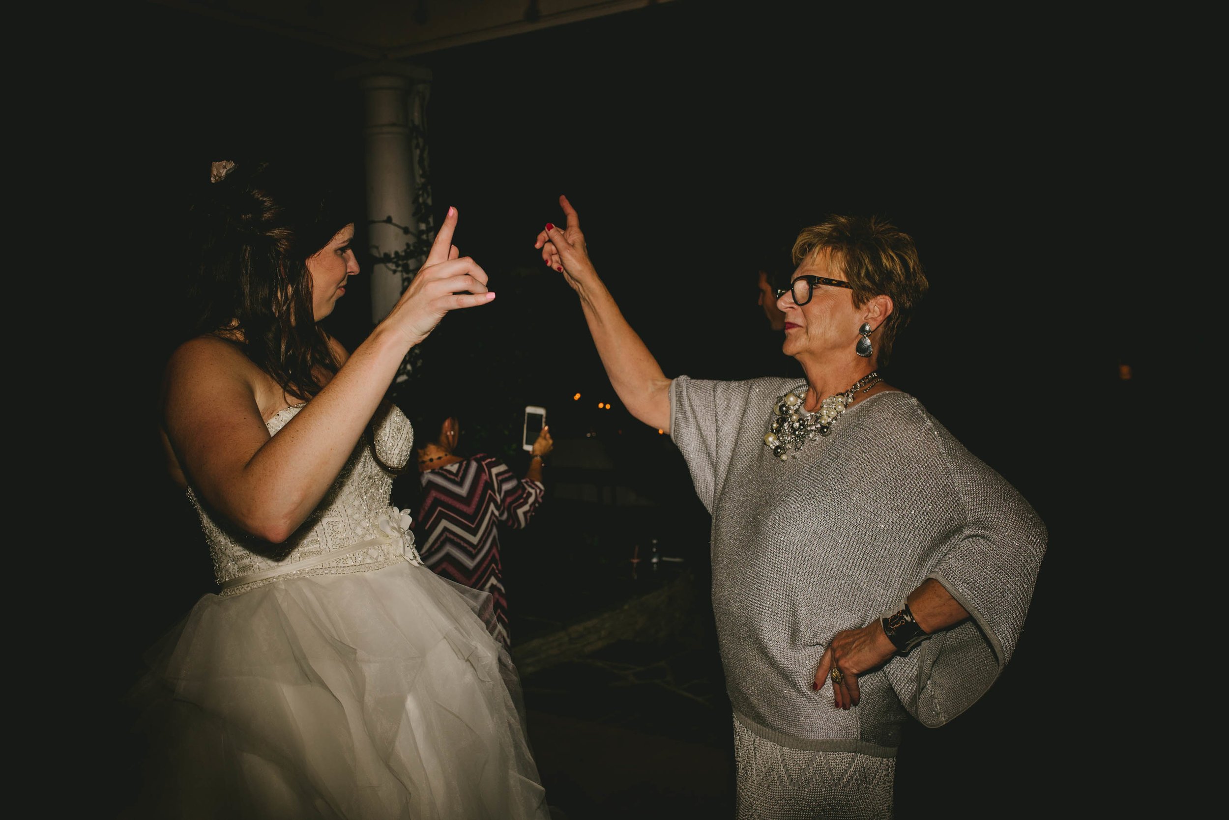 bride and her mom dancing during wedding reception at mims house