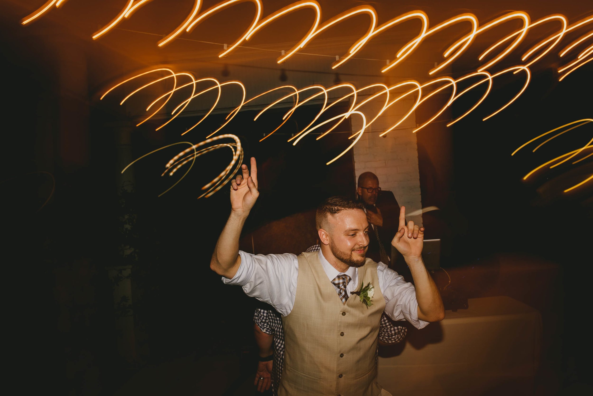 groom dancing during wedding reception at mims house
