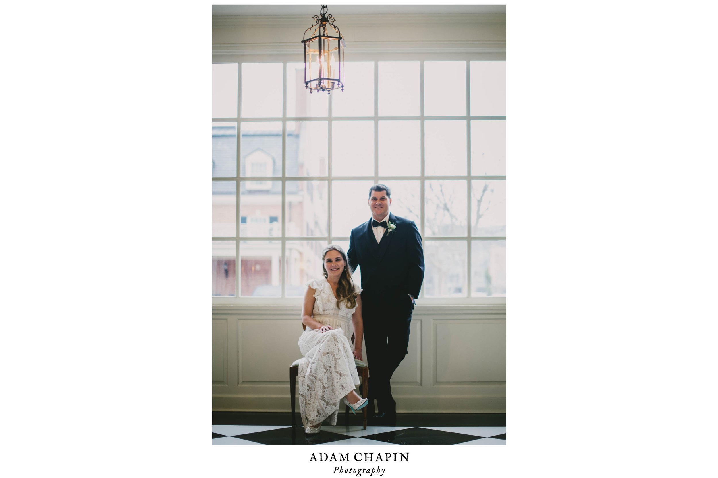 bride and groom sitting in the window light of the Carolina Inn