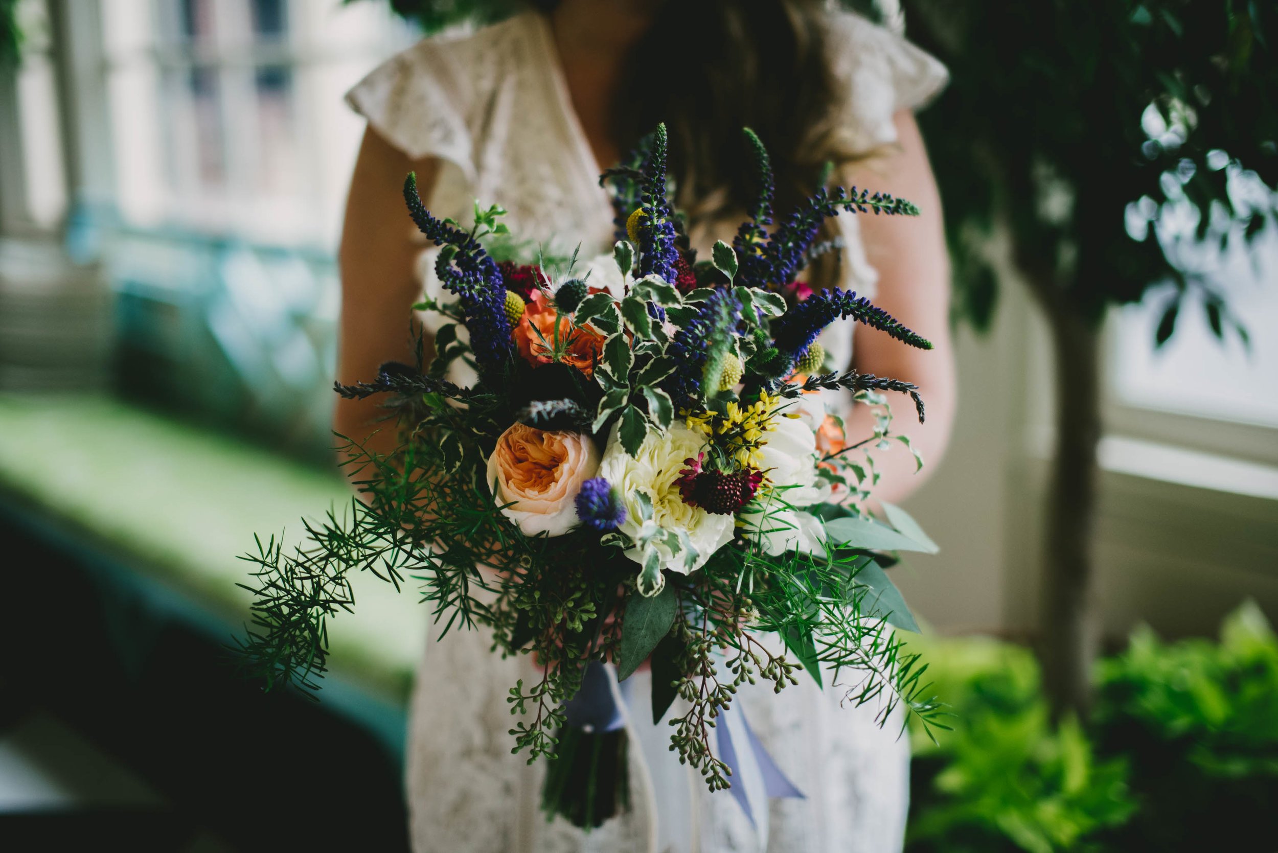 the bride holding her gorgeous bouquet from University Florist