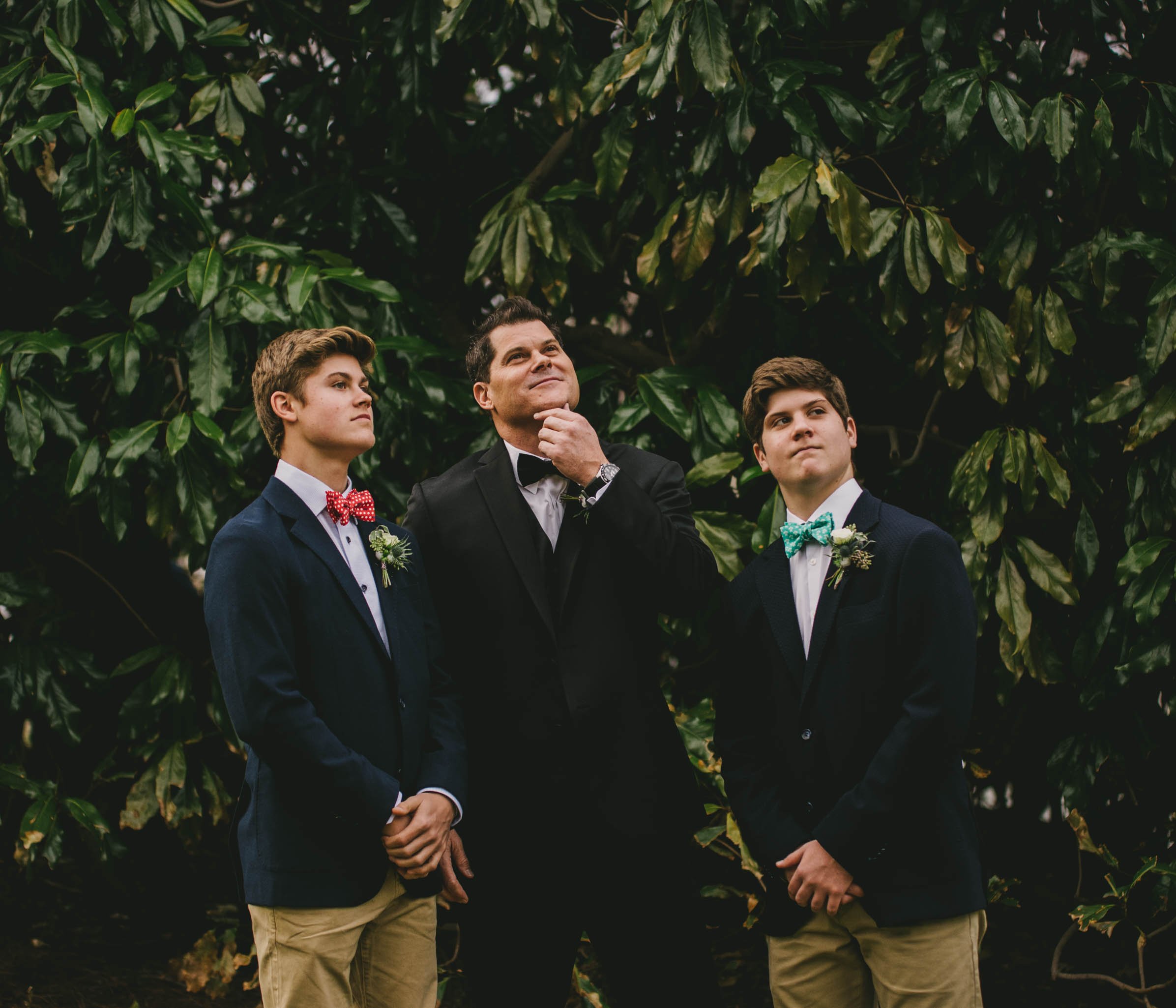 the groom and his sons posing during family portraits