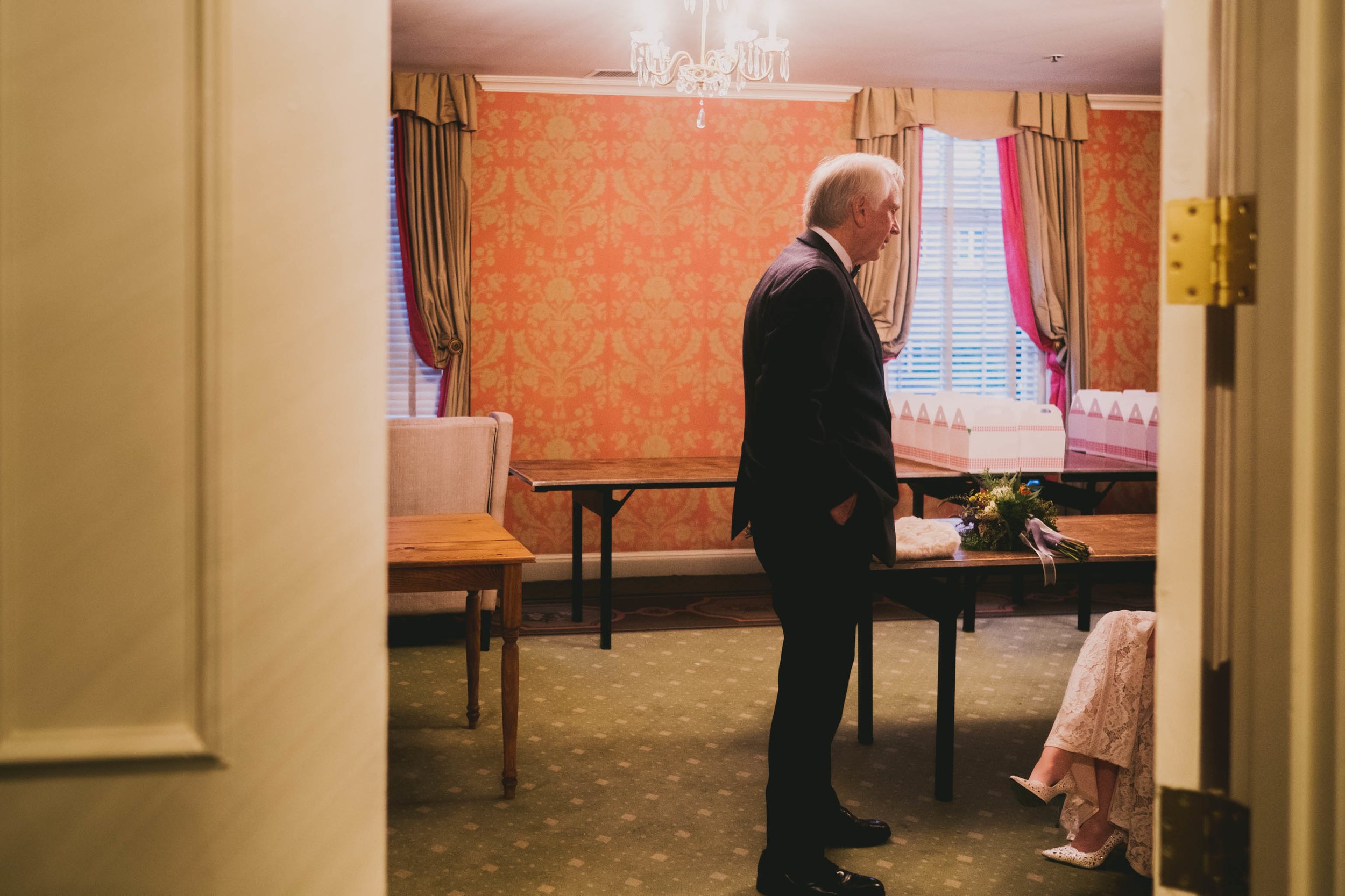 the father of the bride talking to the bride just before the ceremony