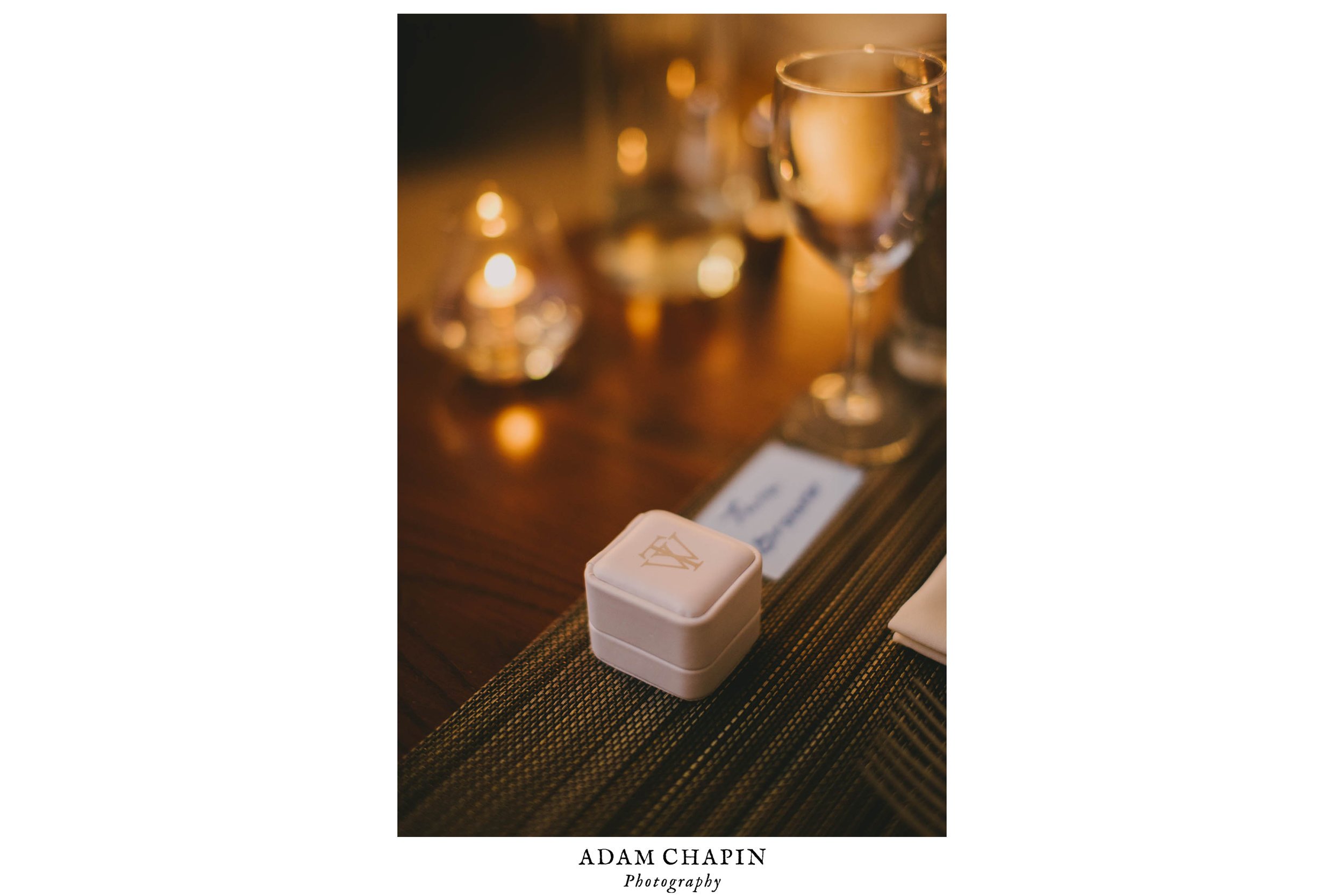 the brides ring box sitting at the head table before dinner