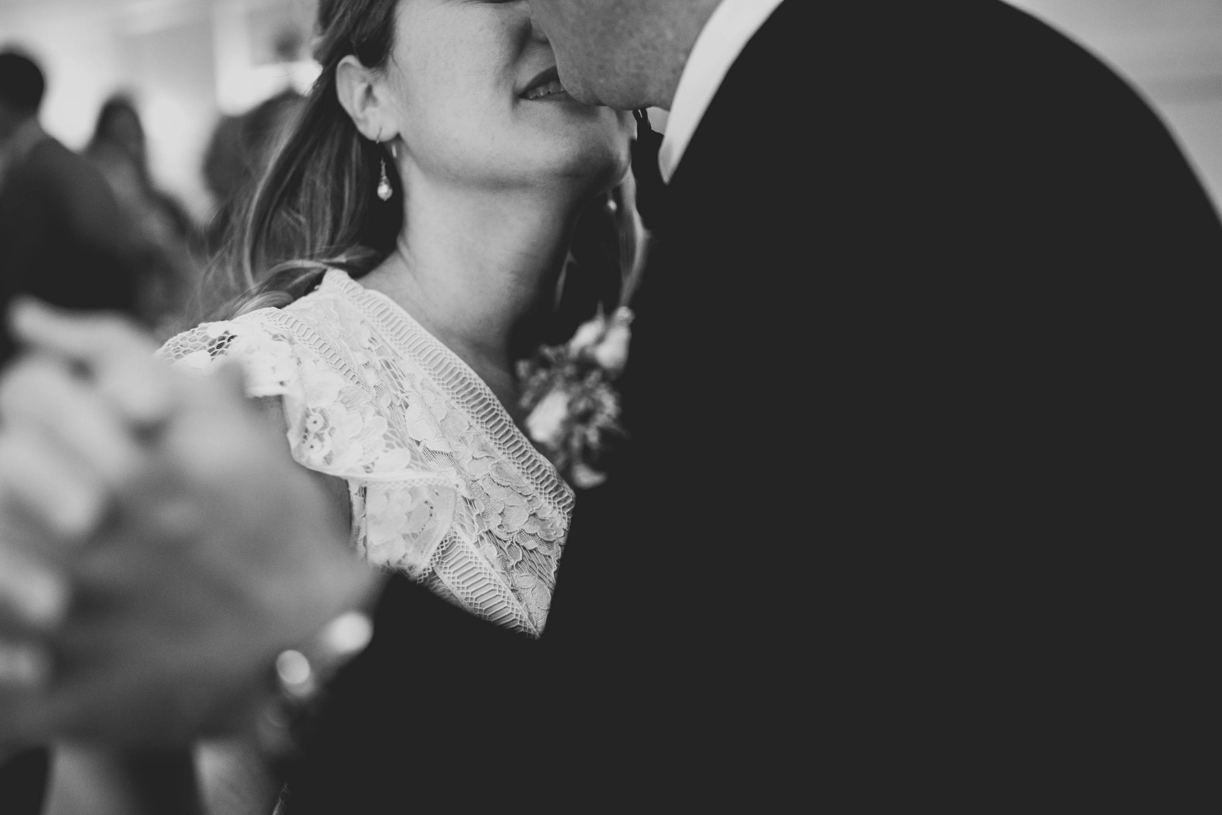 a closs up of the bride and groom during their first dance