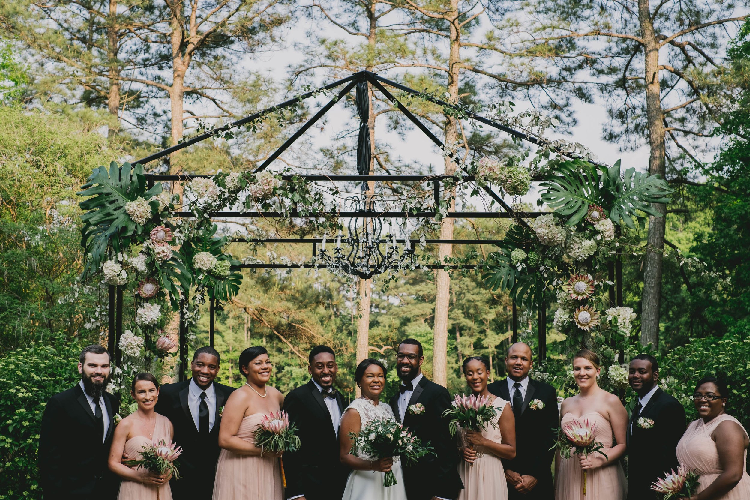 The wedding party of this elegant Umstead Hotel wedding