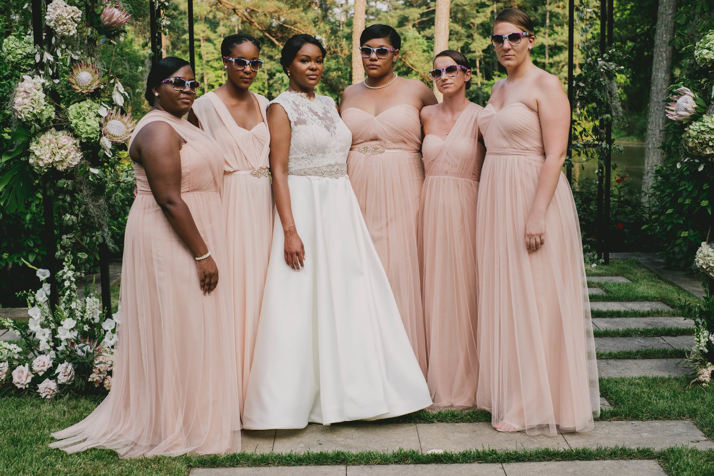 The bride and her bridesmaids looking amazing in their dresses