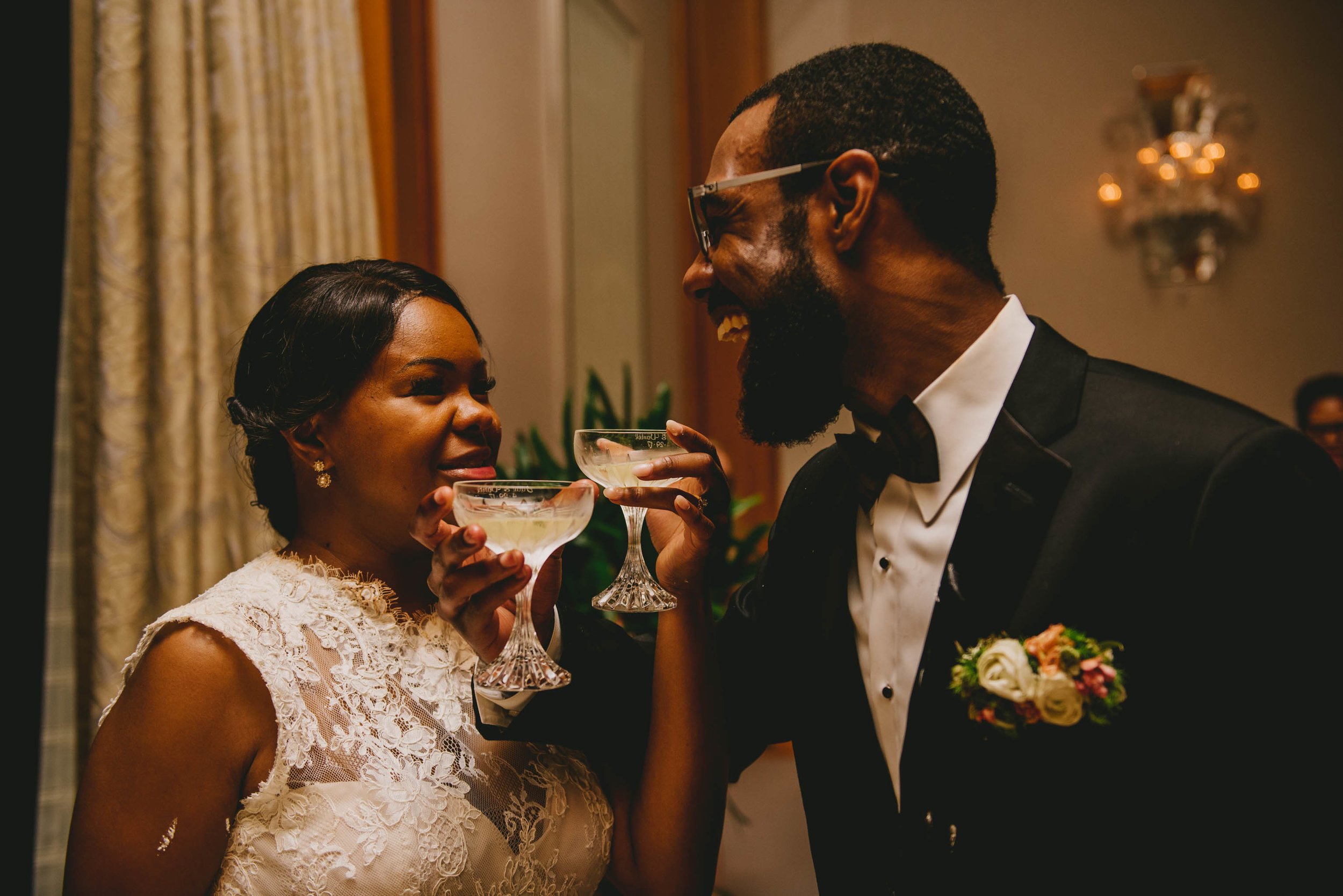 The bride and groom share in a toast at this Raleigh wedding