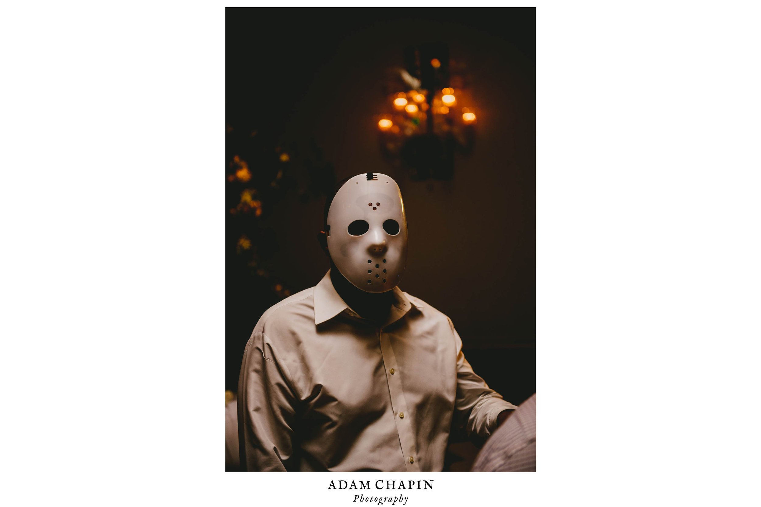 A groomsmen dons a Jason mask during this offbeat Raleigh wedding
