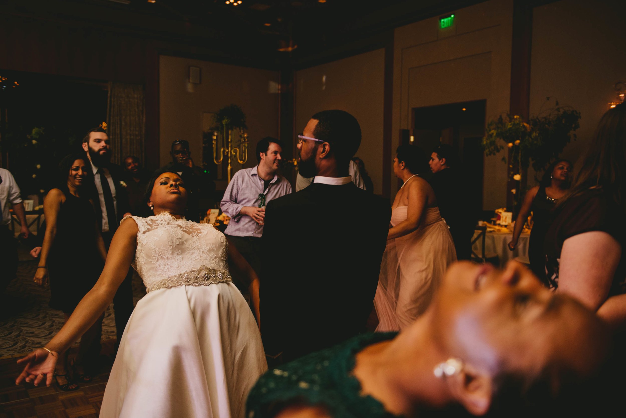 The bride and groom shake it out at their Umstead Hotel wedding