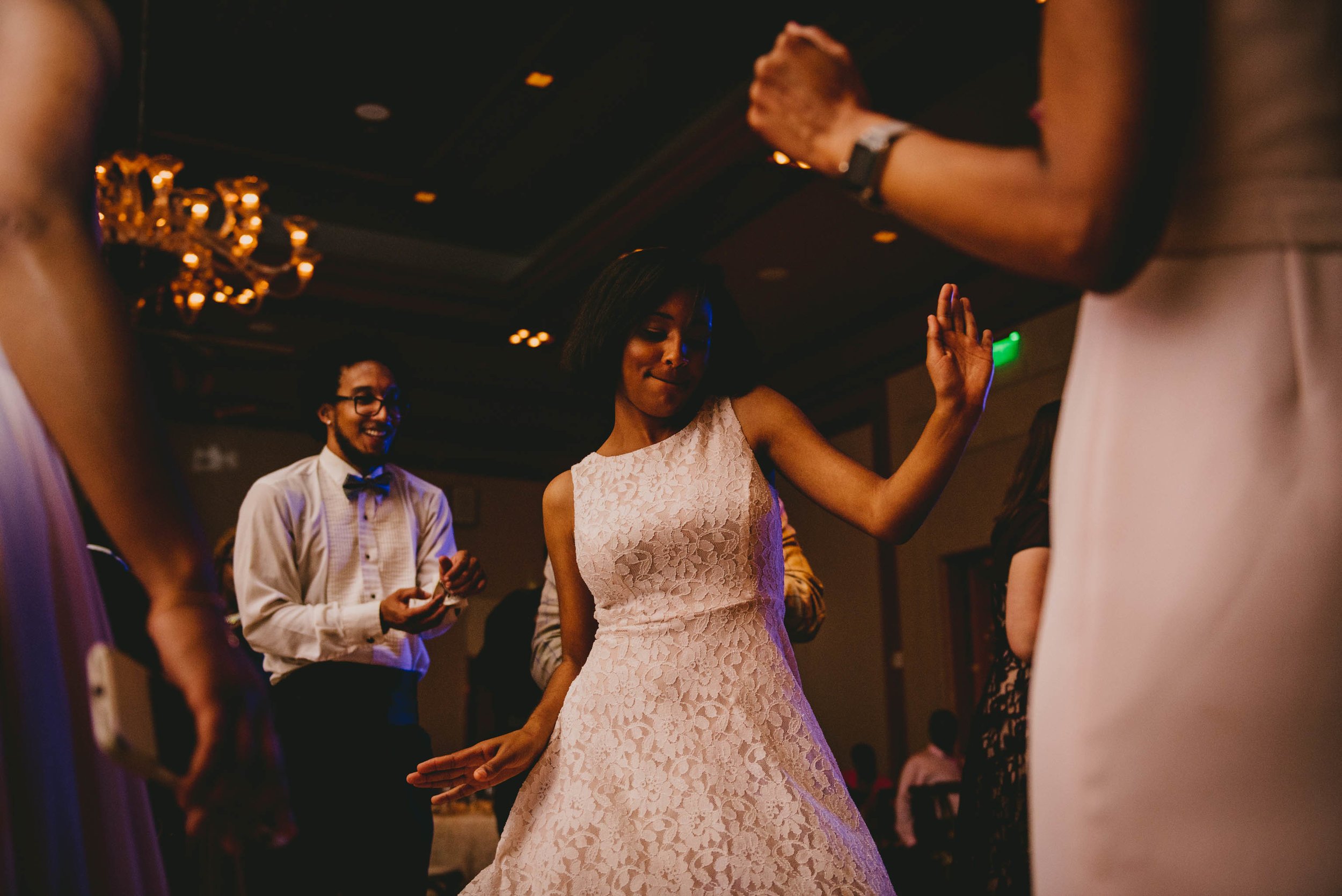 A wedding guest dancing it out during this Raleigh wedding
