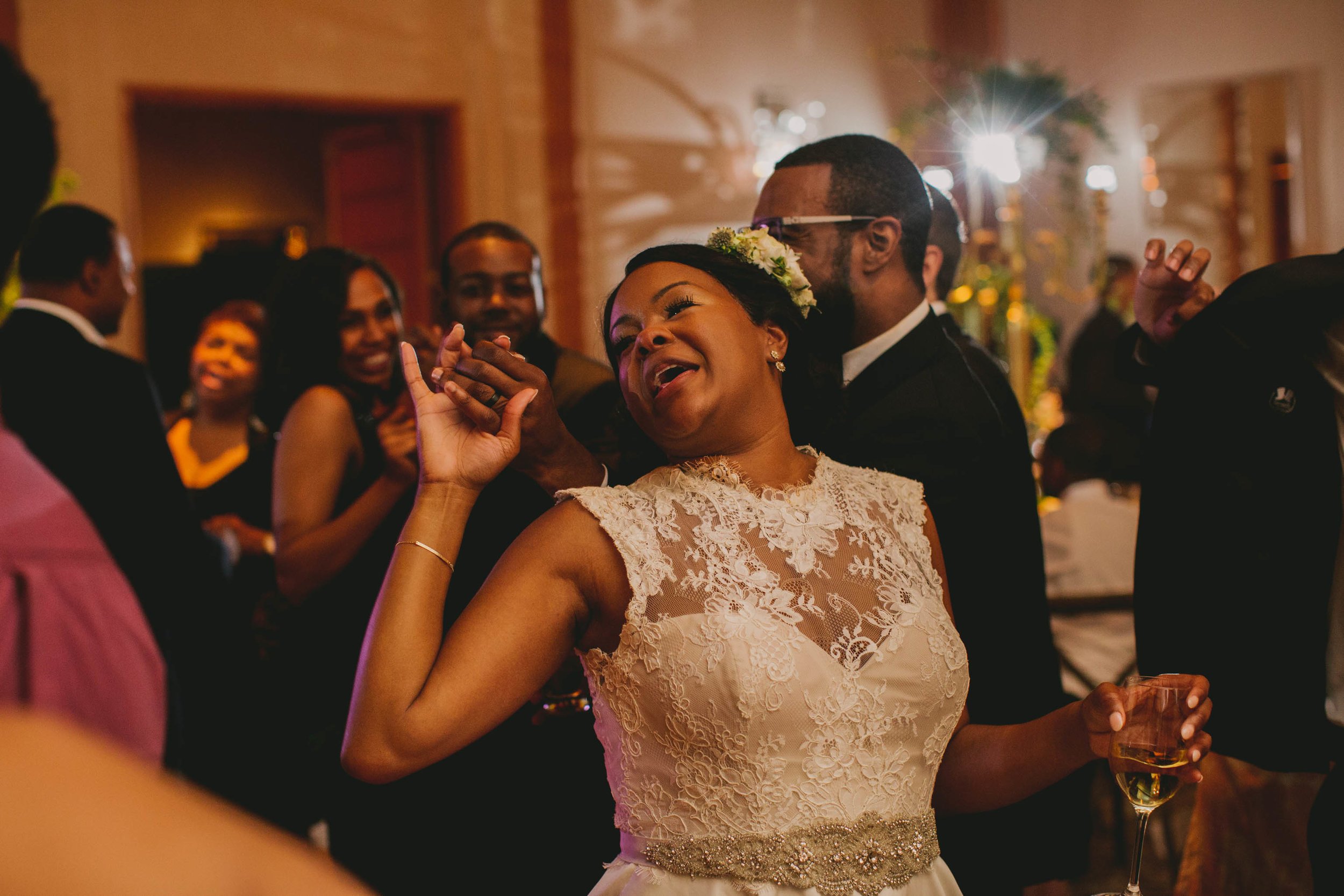 The bride and groom living it up during the last dance at their elegant Umstead Hotel and Spa wedding in Cary, NC