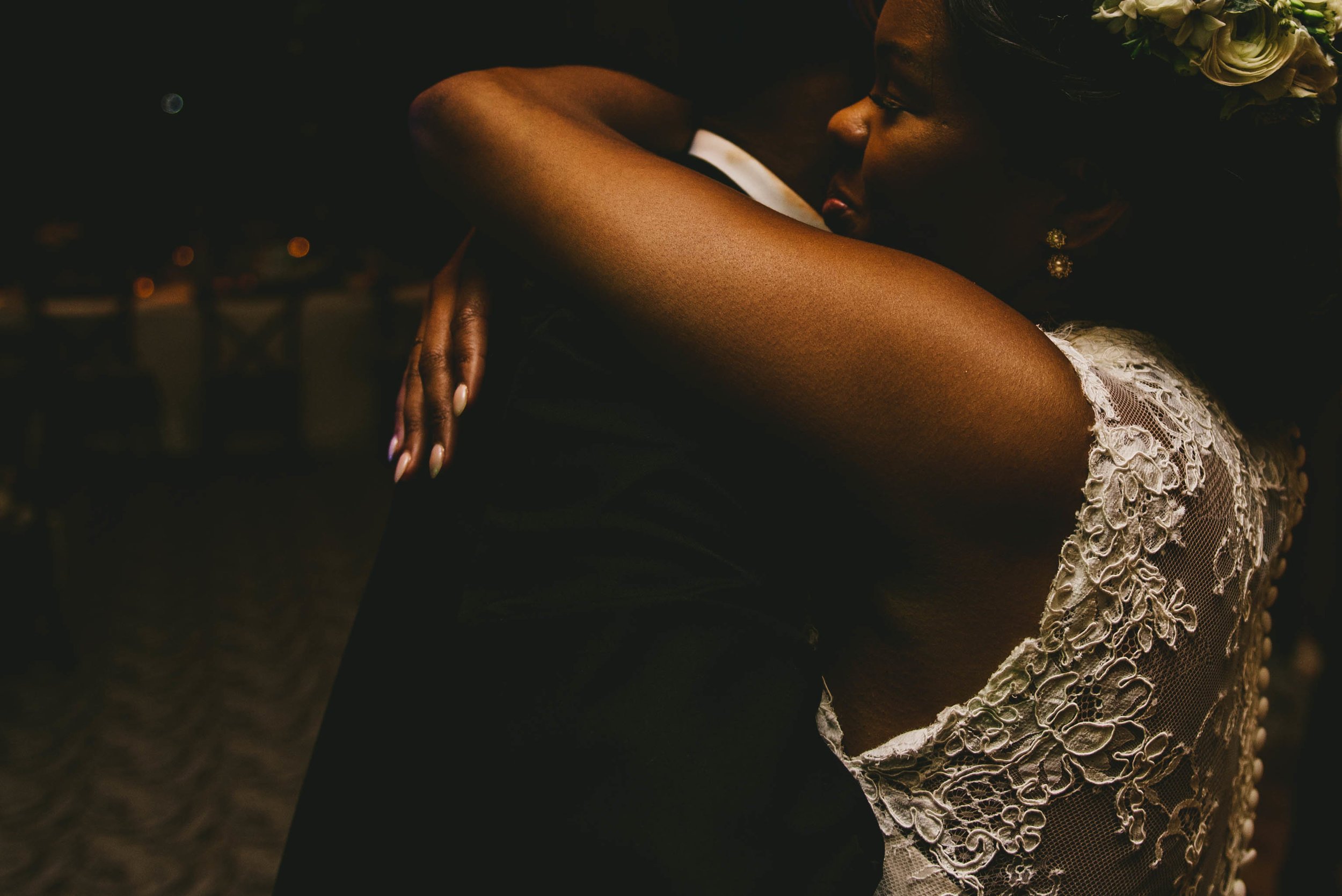 The bride and groom share a hug during their elegant Raleigh wedding
