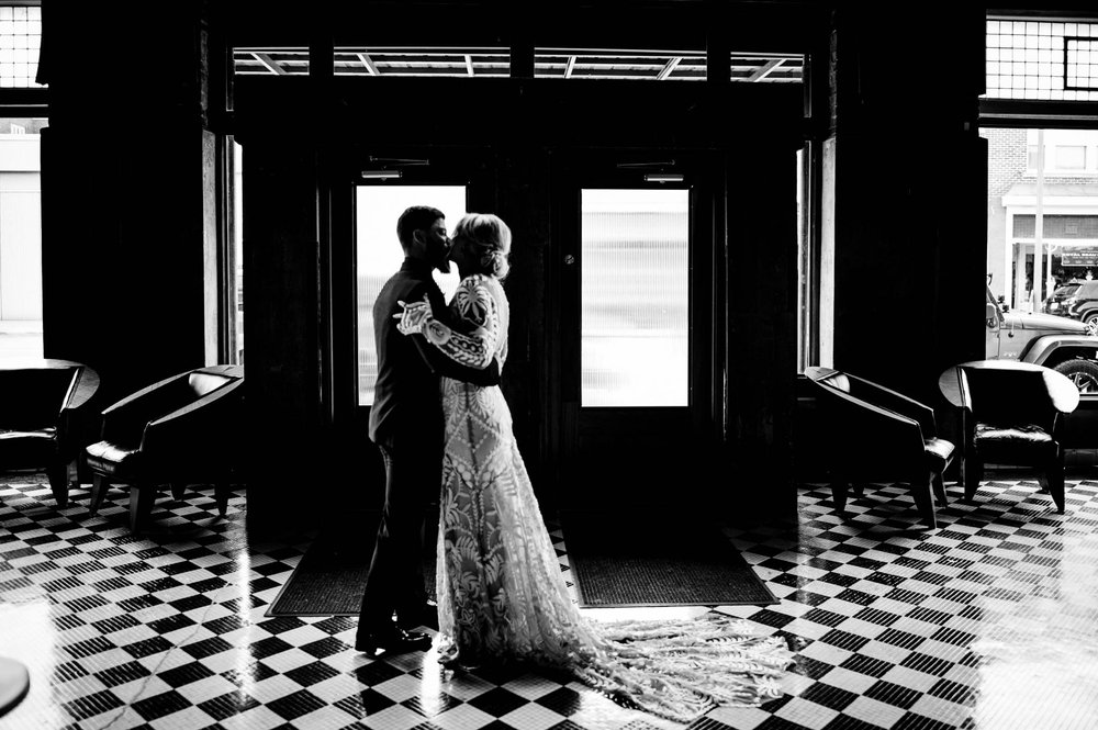 bride and groom kiss during their first look