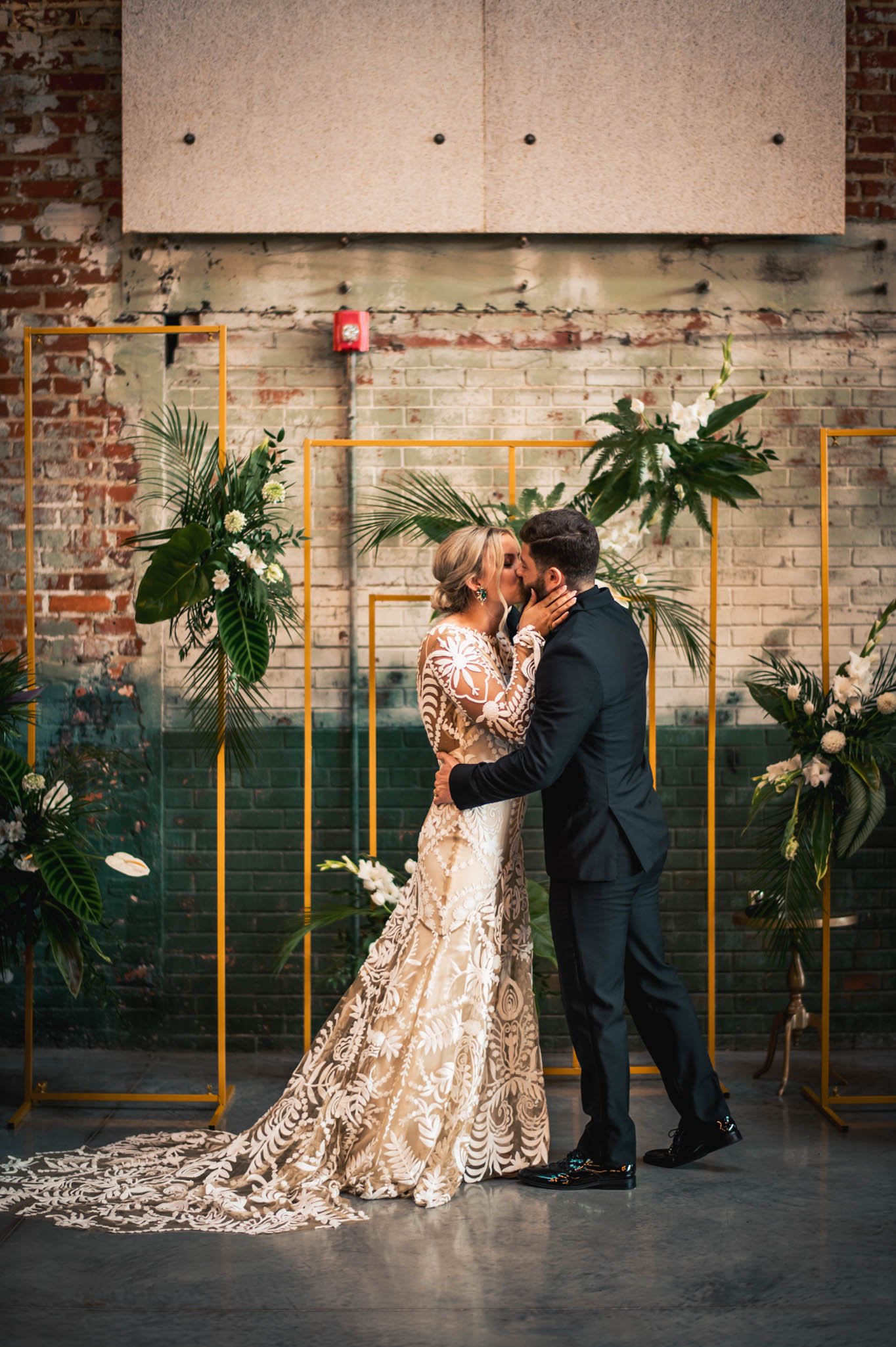 bride and groom kiss after their wedding ceremony