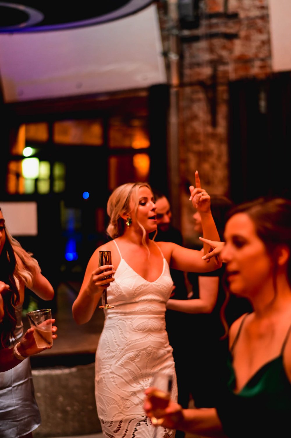 bride singing and dancing during the reception