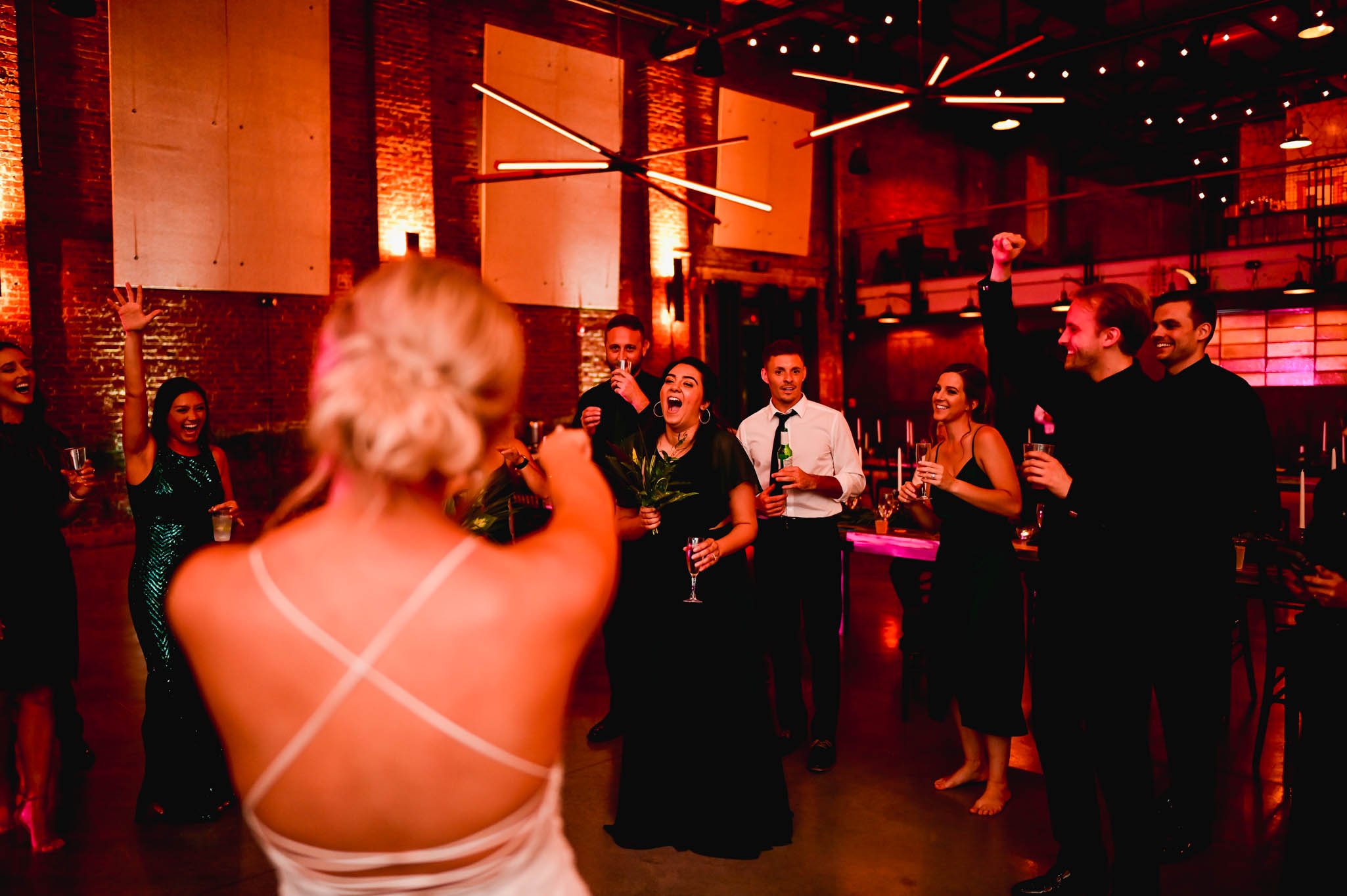 bride and groom get a dance circle going during their wedding reception