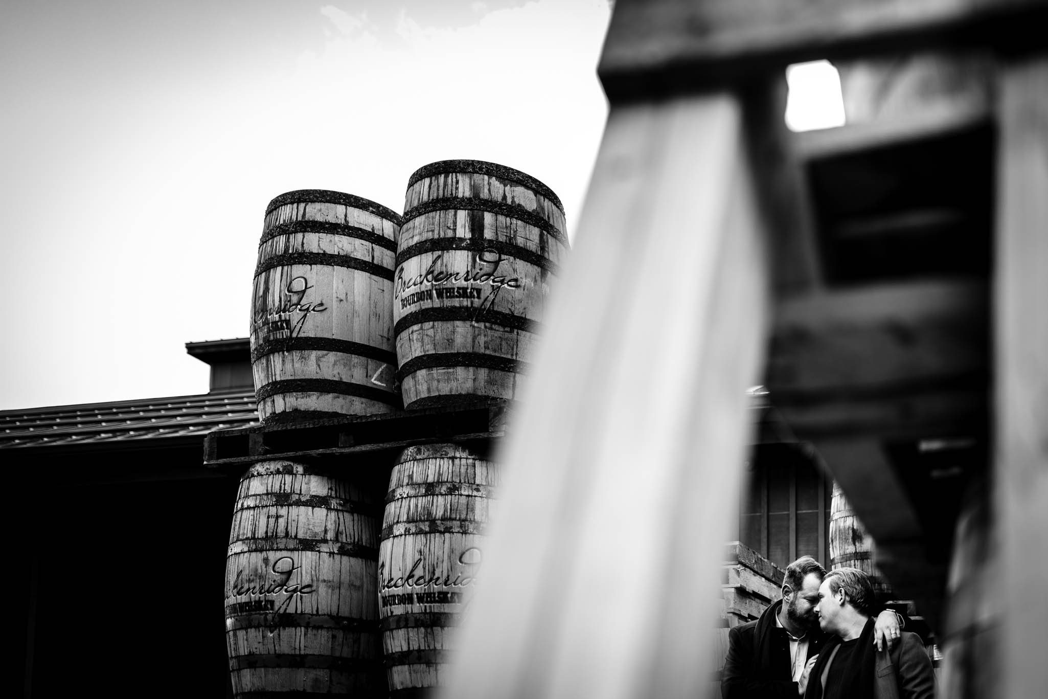 couple as seen through a cut through in a pallet at the Breckenridge Distillery