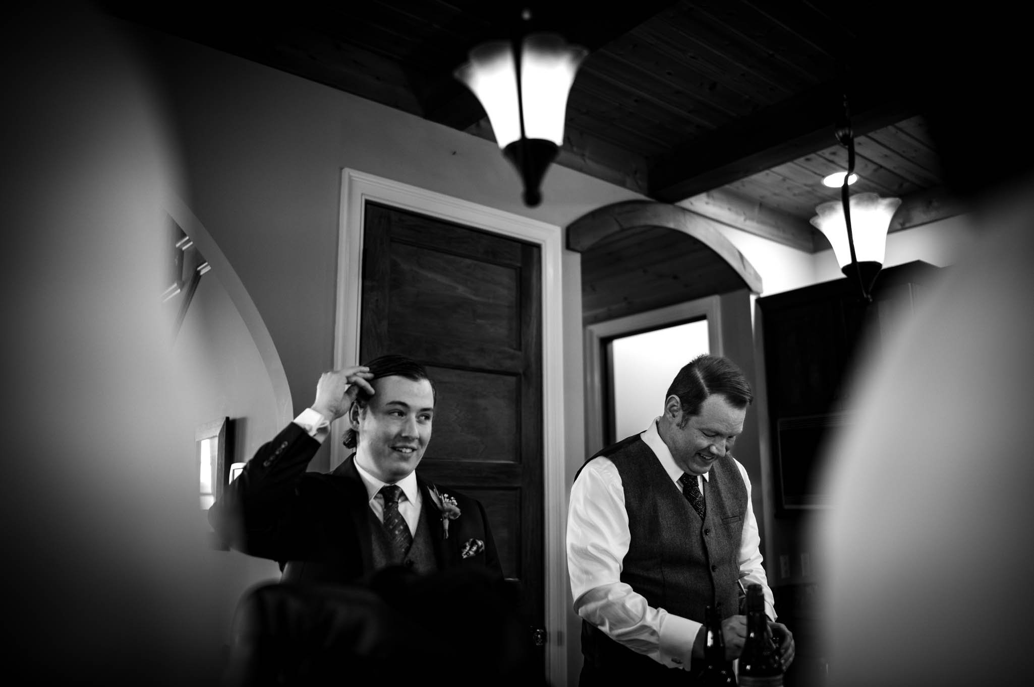 two grooms prepare cocktails before the weddings