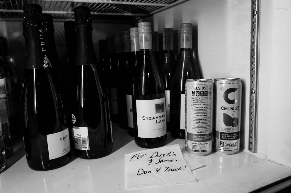 a special note is left in a cooler to remind people of the grooms special drinks for the reception