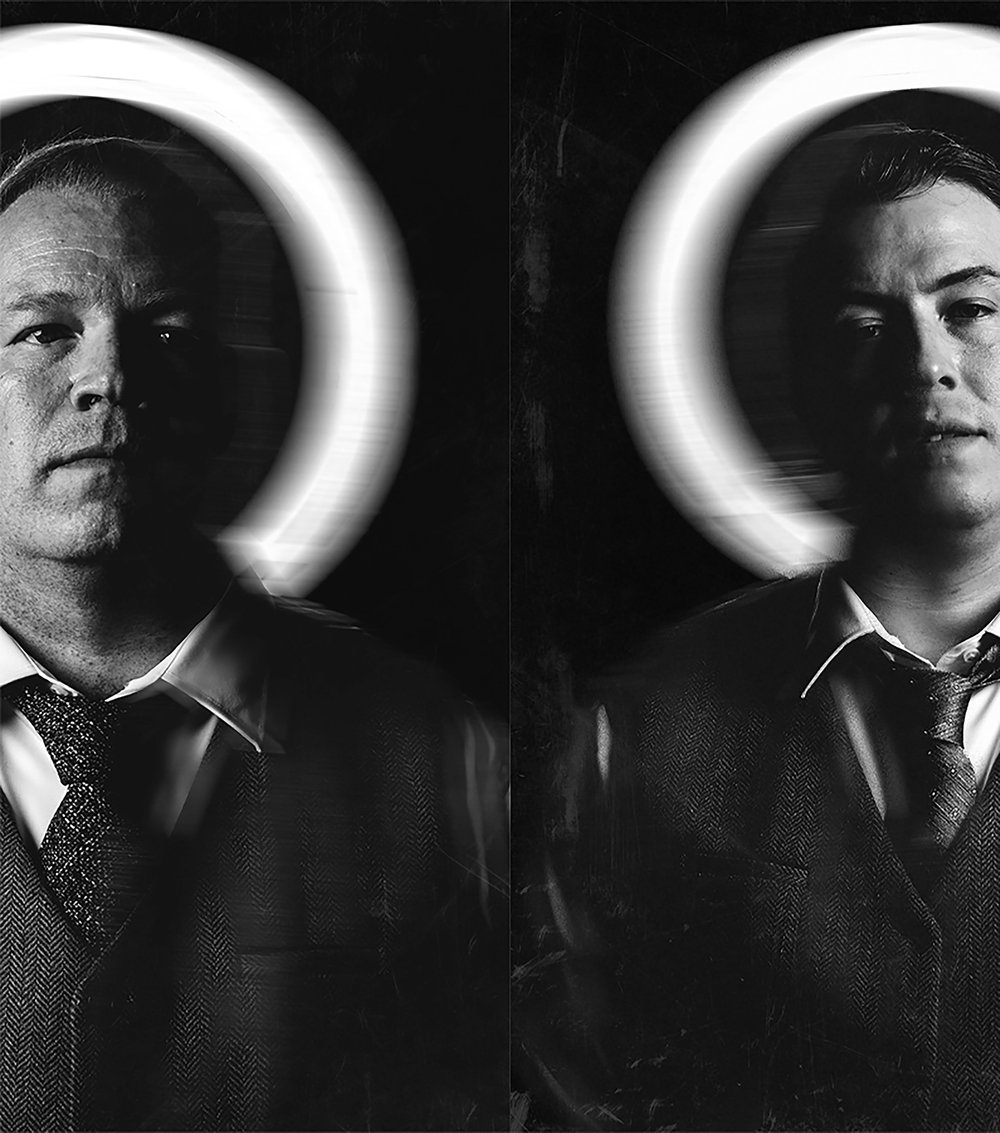 two grooms dramatically captured with light halos behind their heads