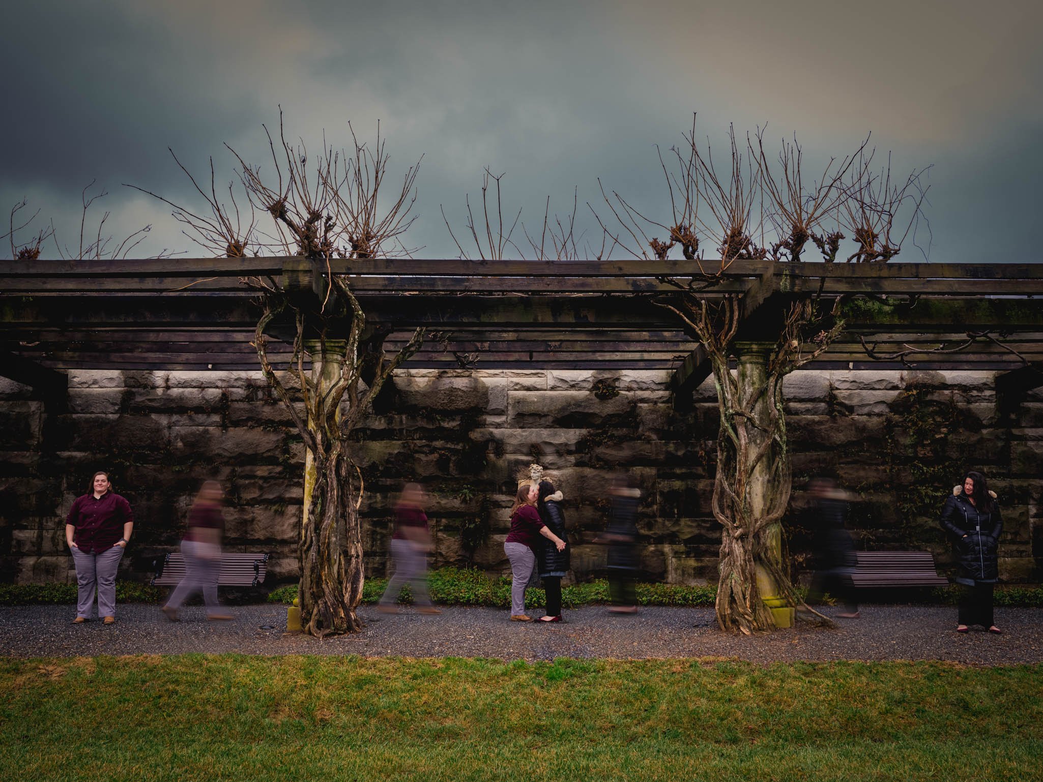 couple coming together under the arbor at the Biltmore house