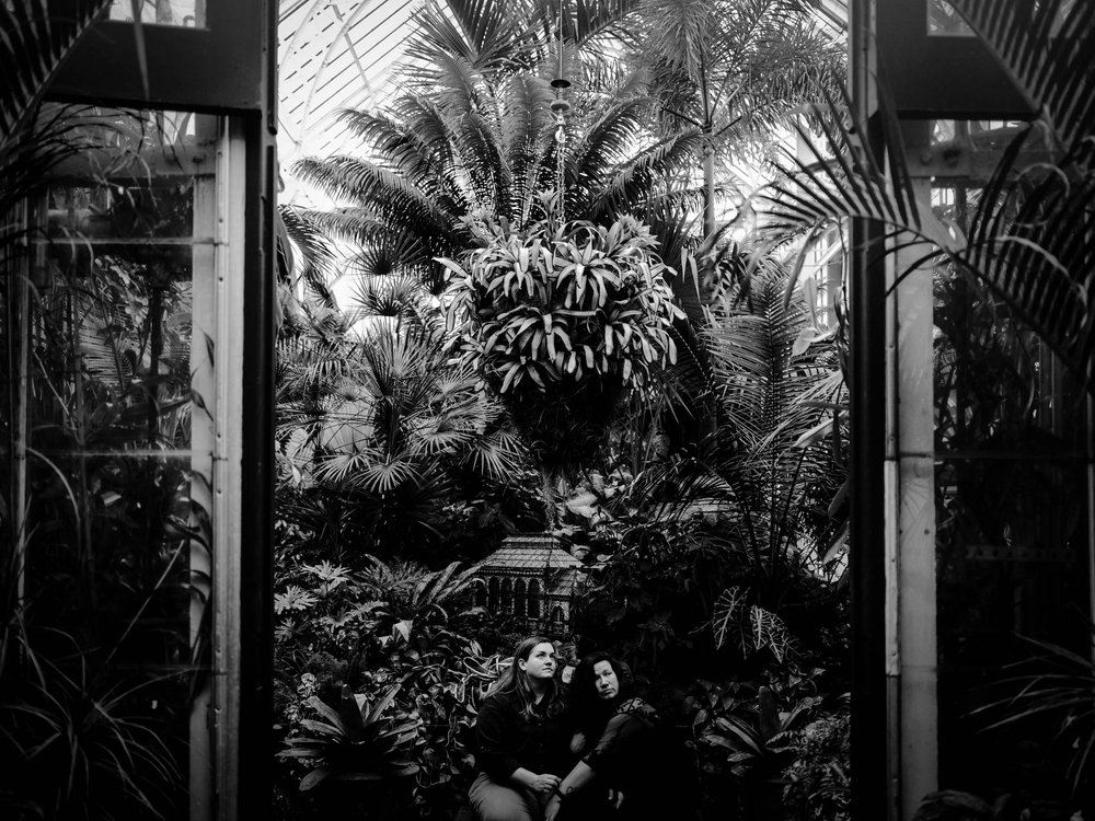 couple sitting together in the Biltmore house greenhouse