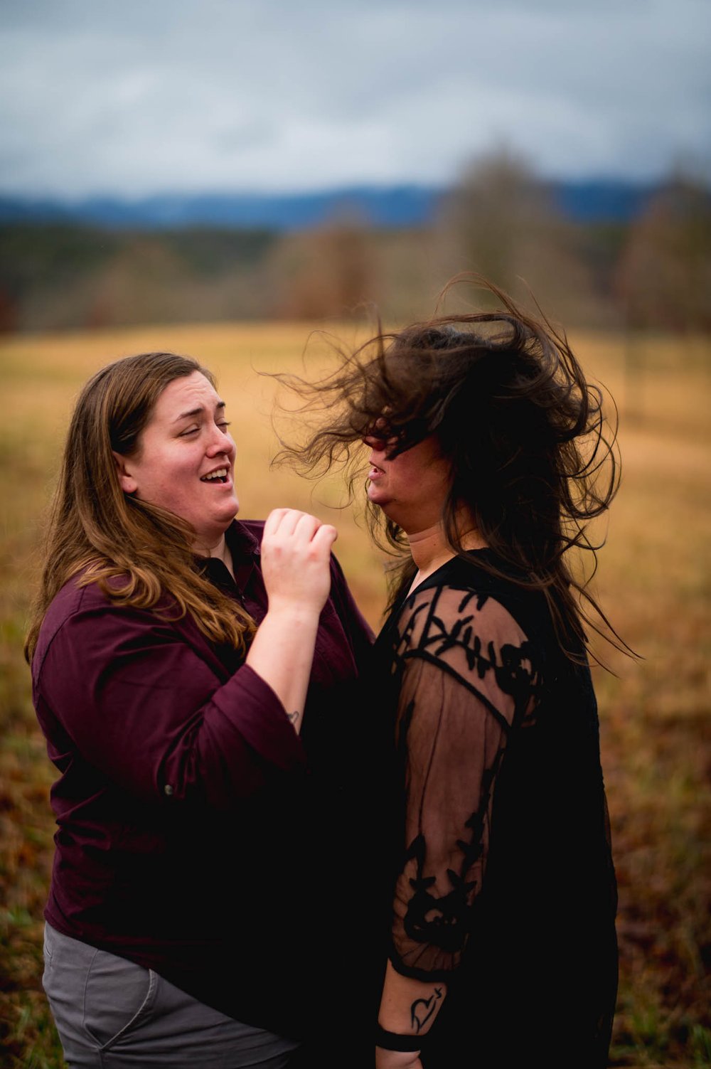 a woman's hair gets tossed around during this Biltmore engagement session