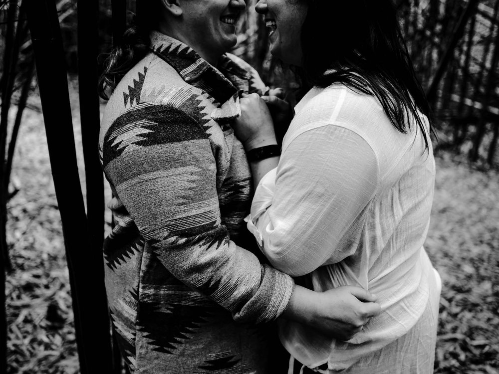 a couple embracing amidst the bamboo forest on the Biltmore property